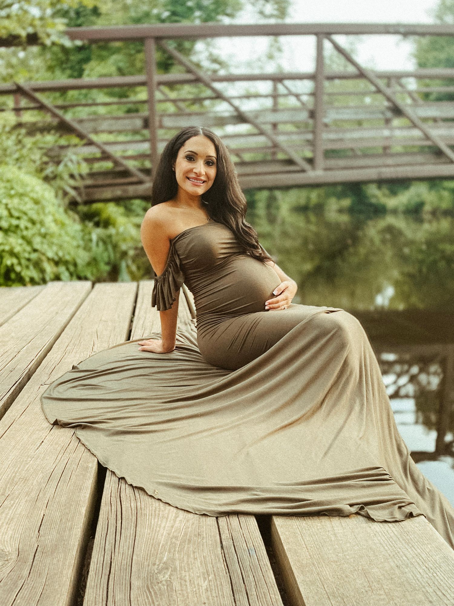 Heartfelt and candid family moment captured outdoors, reflecting the natural connection and joy of motherhood.