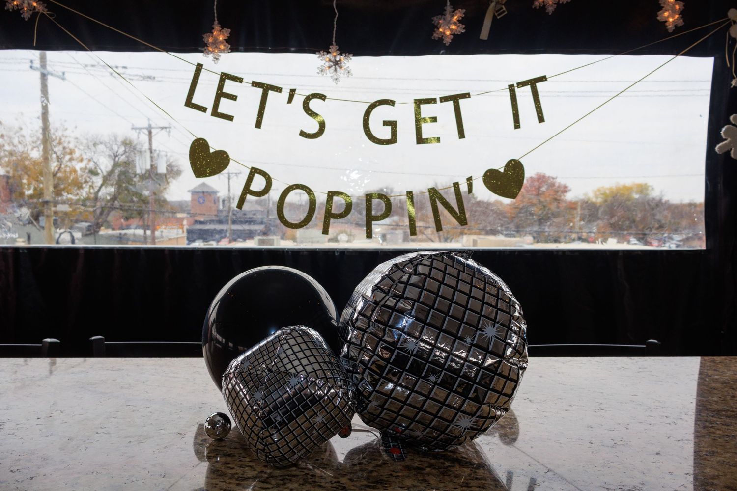 Disco balls displayed under a glittery 