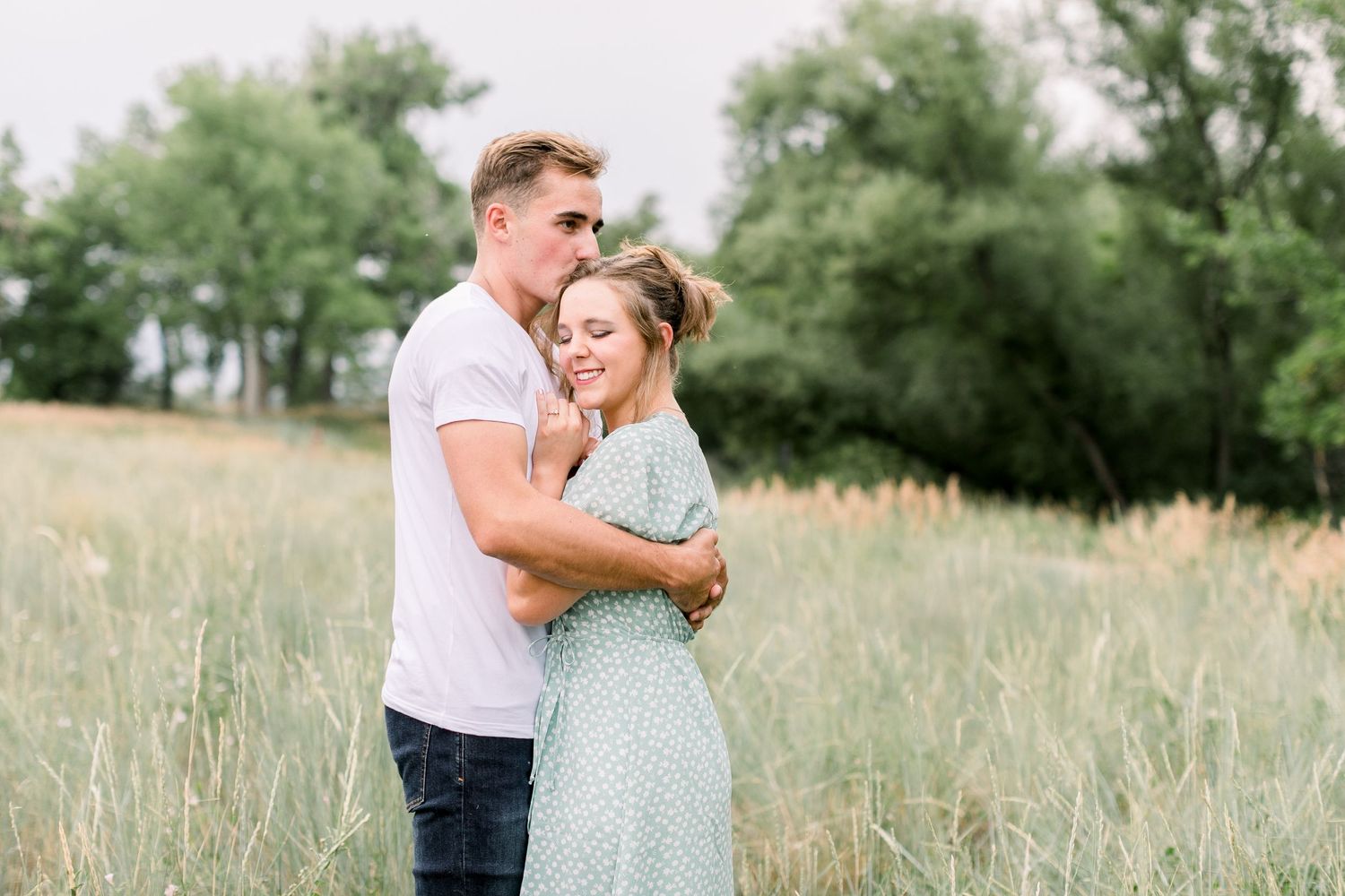 Couple embracing during Longmont Colorado engagement session