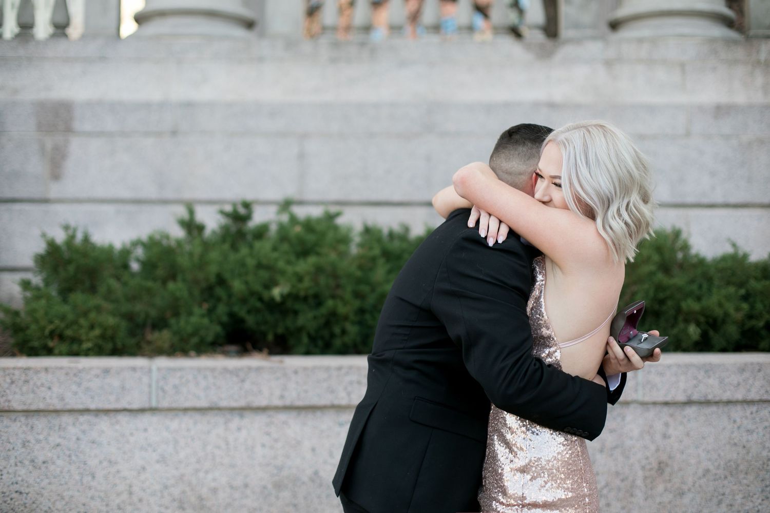 A couple hugging after their proposal