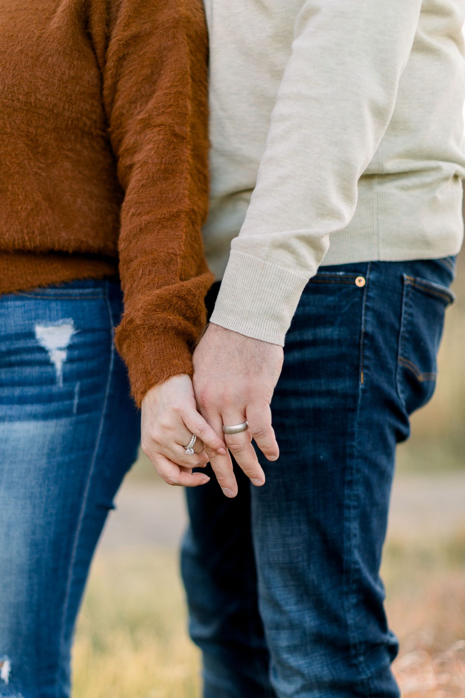 A close up of a married couples weddings rings during their anniversary photo session