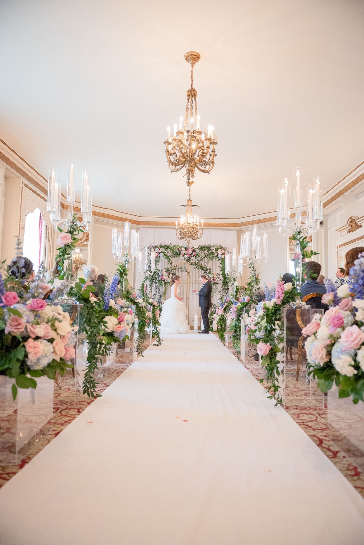 Bride and groom celebrating their wedding ceremony  at Chateau Laurier, captured by a bright and airy Ottawa wedding photographer