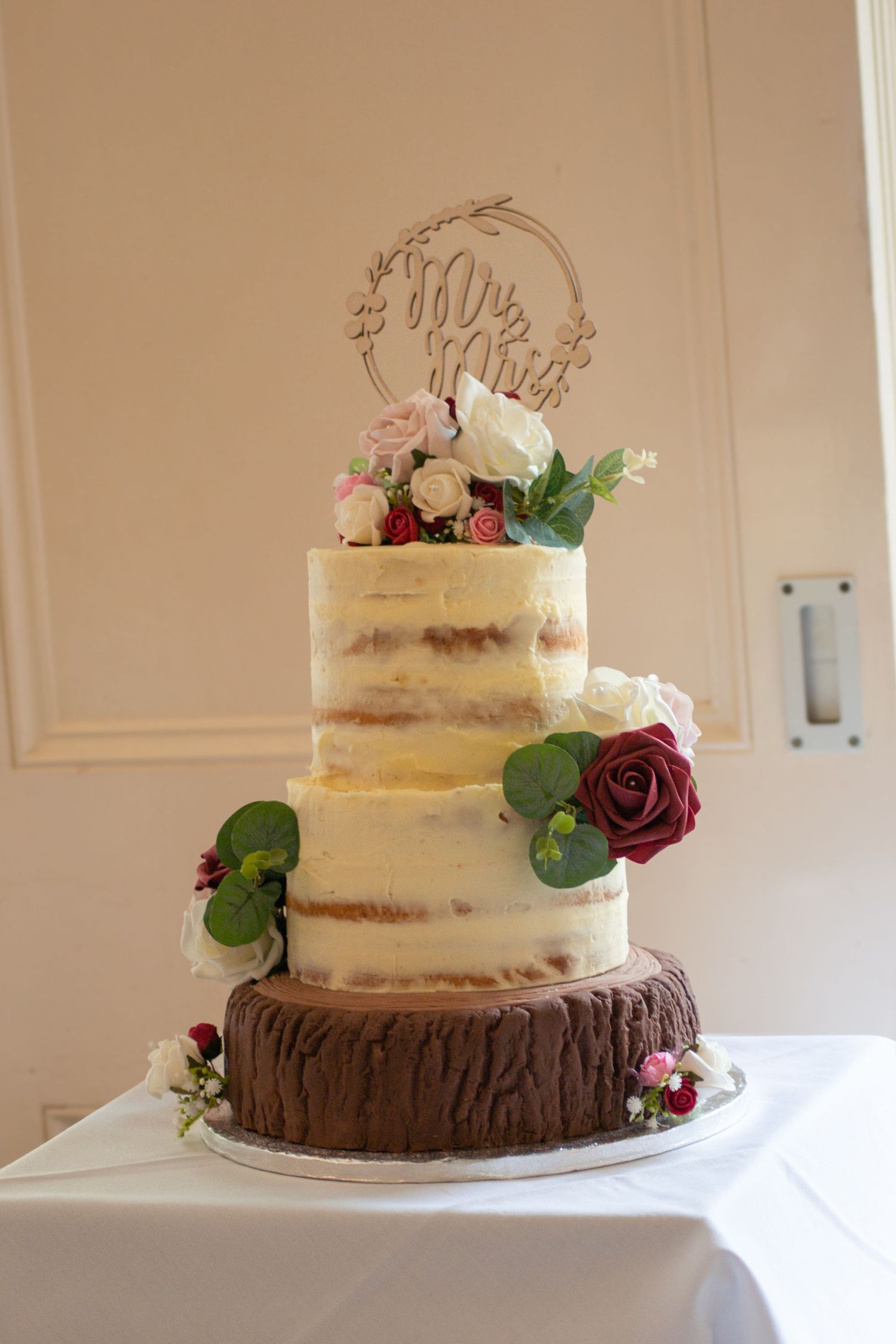 Bride and groom cutting their wedding cake.