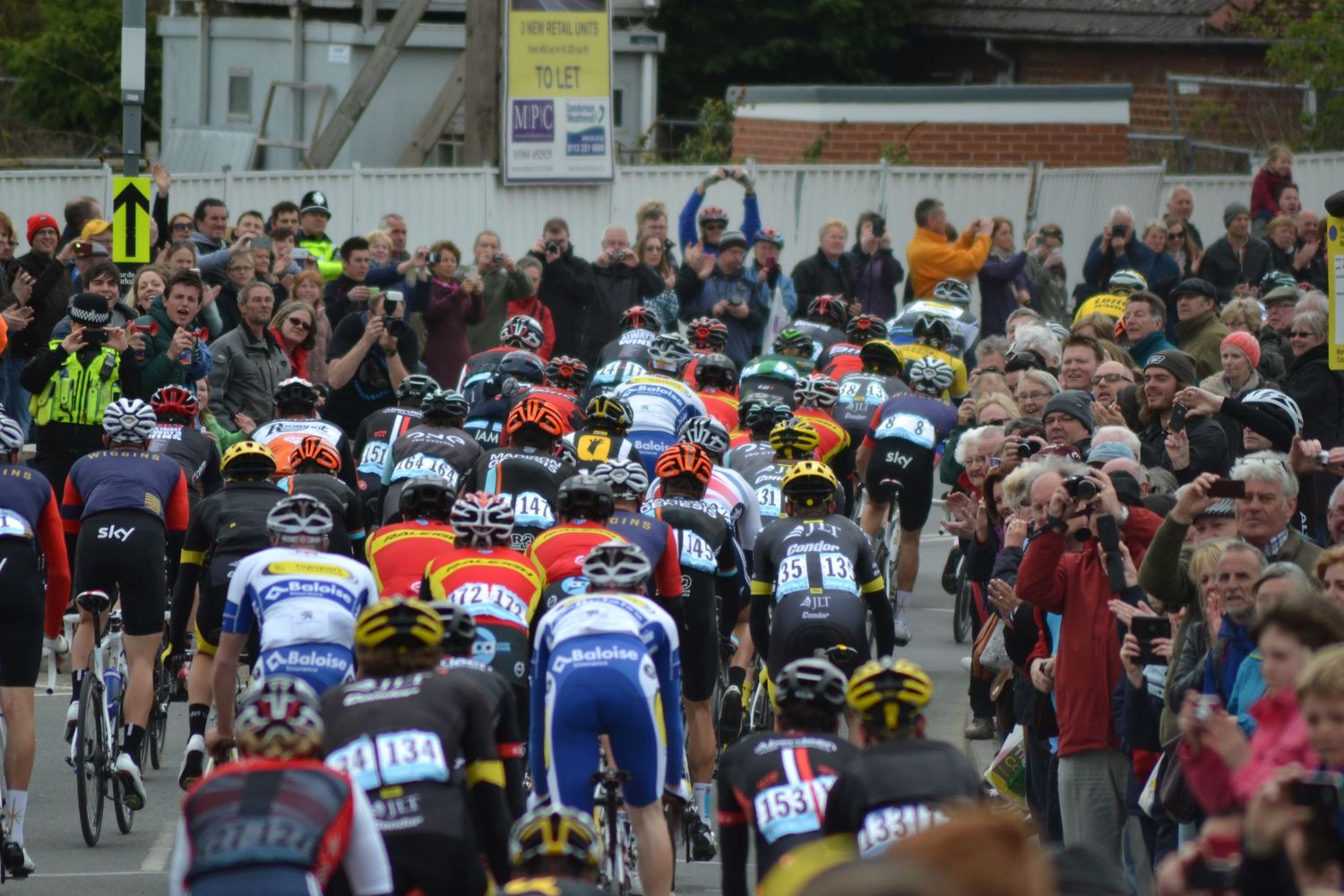 Hundreds of cyclists biking during the Tour De Yorkshire cycling event.