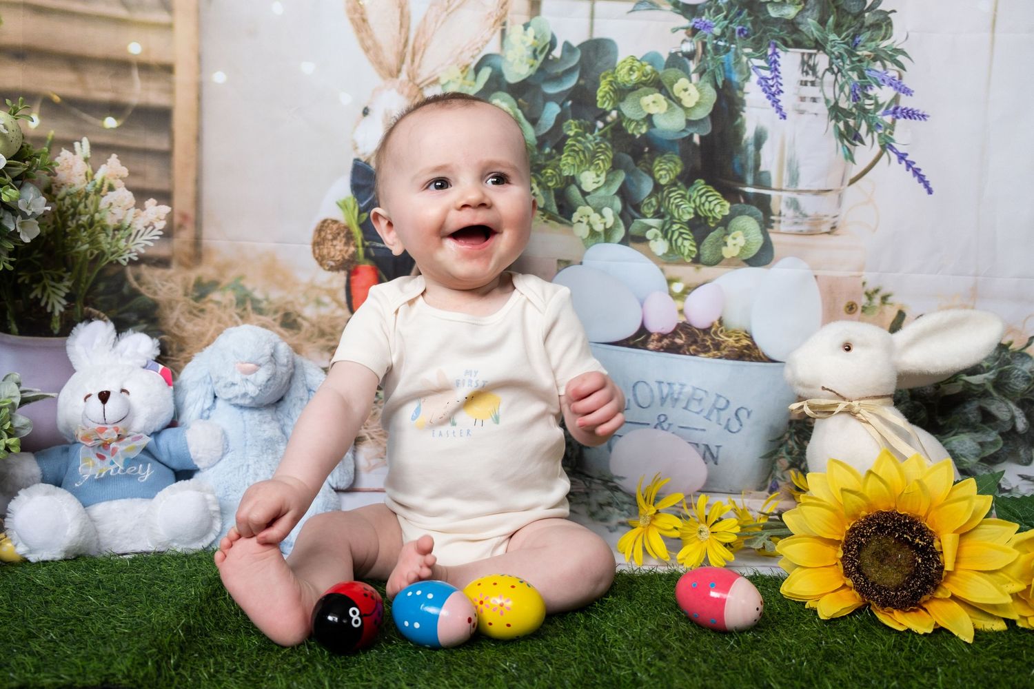 Easter-themed children's portrait with spring decorations.