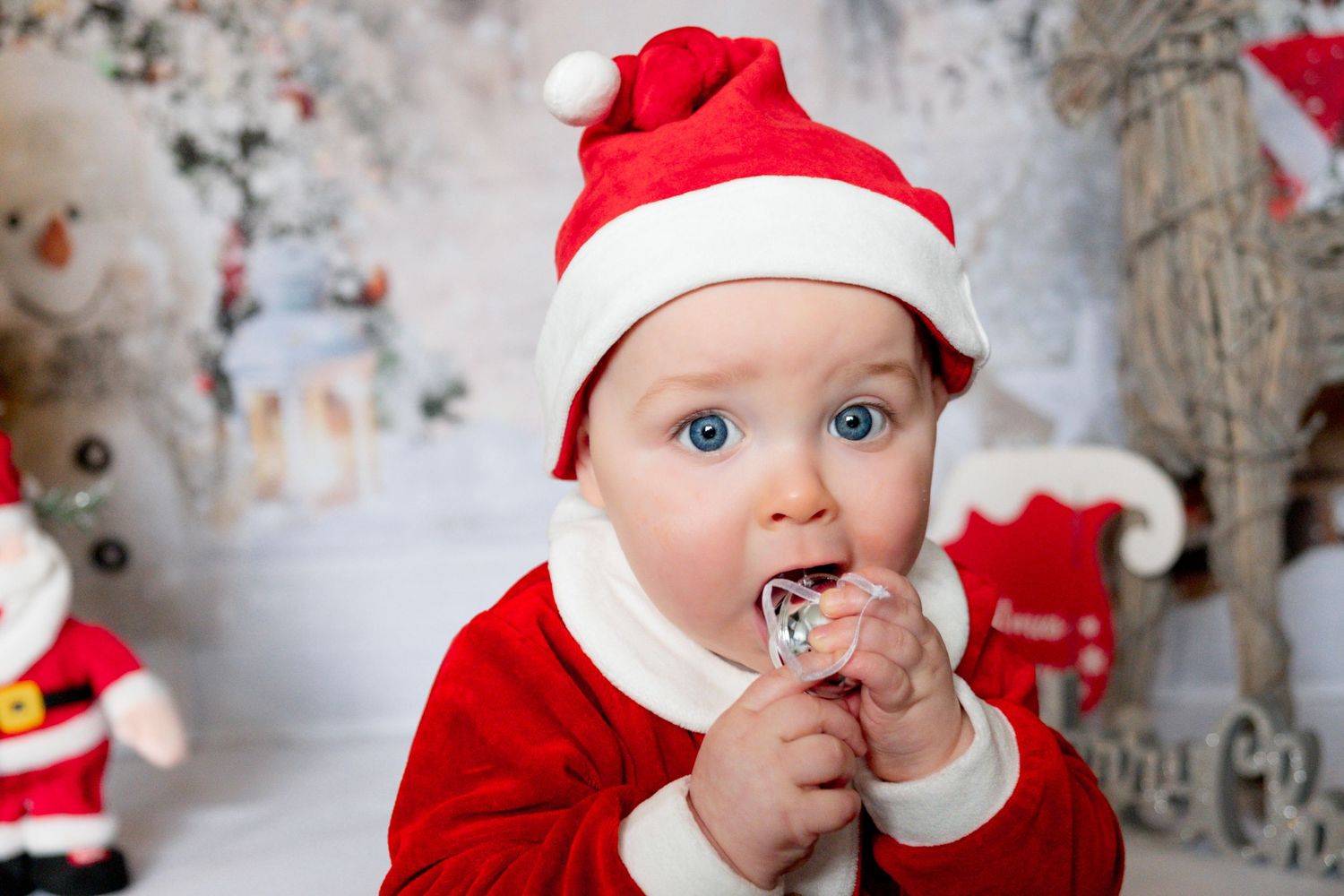 Little boy smiling during a Christmas mini photoshoot.