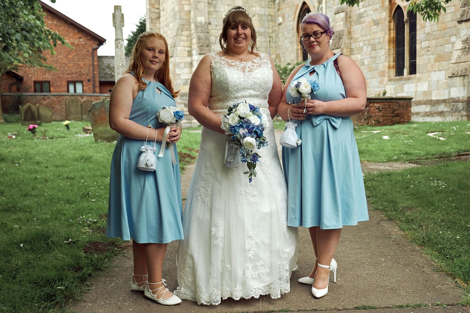 Bride with her bridesmaids outside the church.