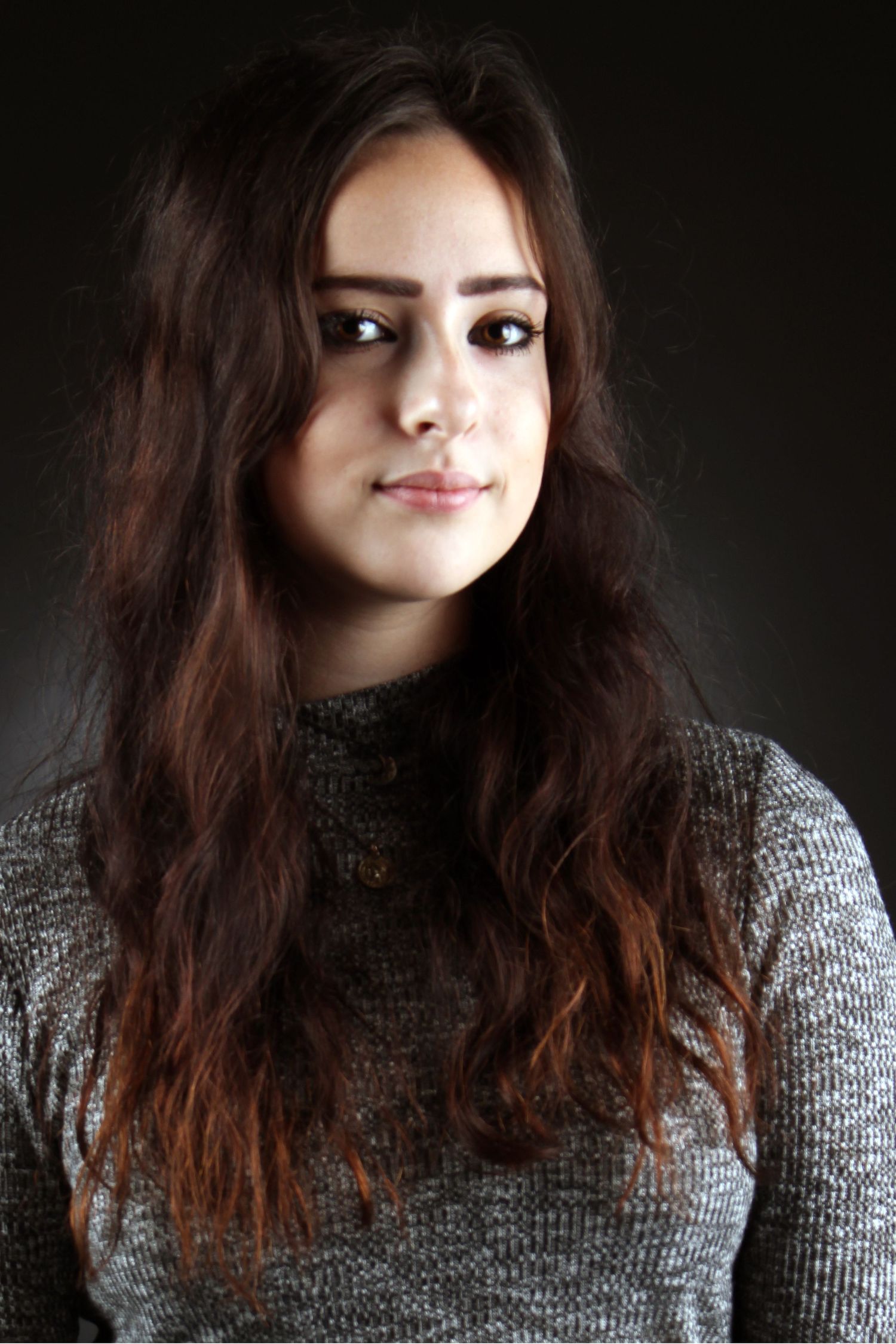 studio shot of a girl in low lighting.