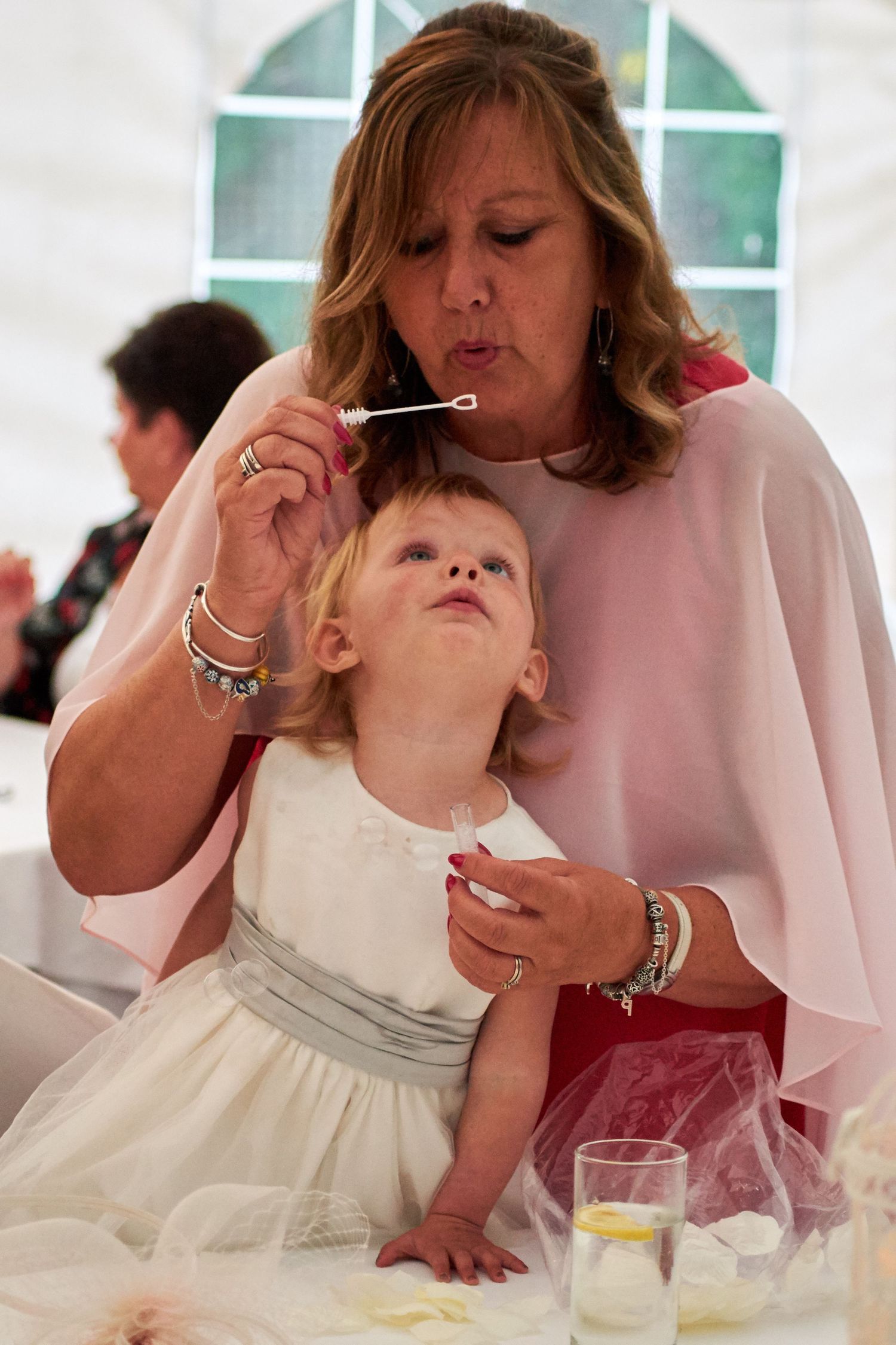 FLower girl with the mother of the groom.