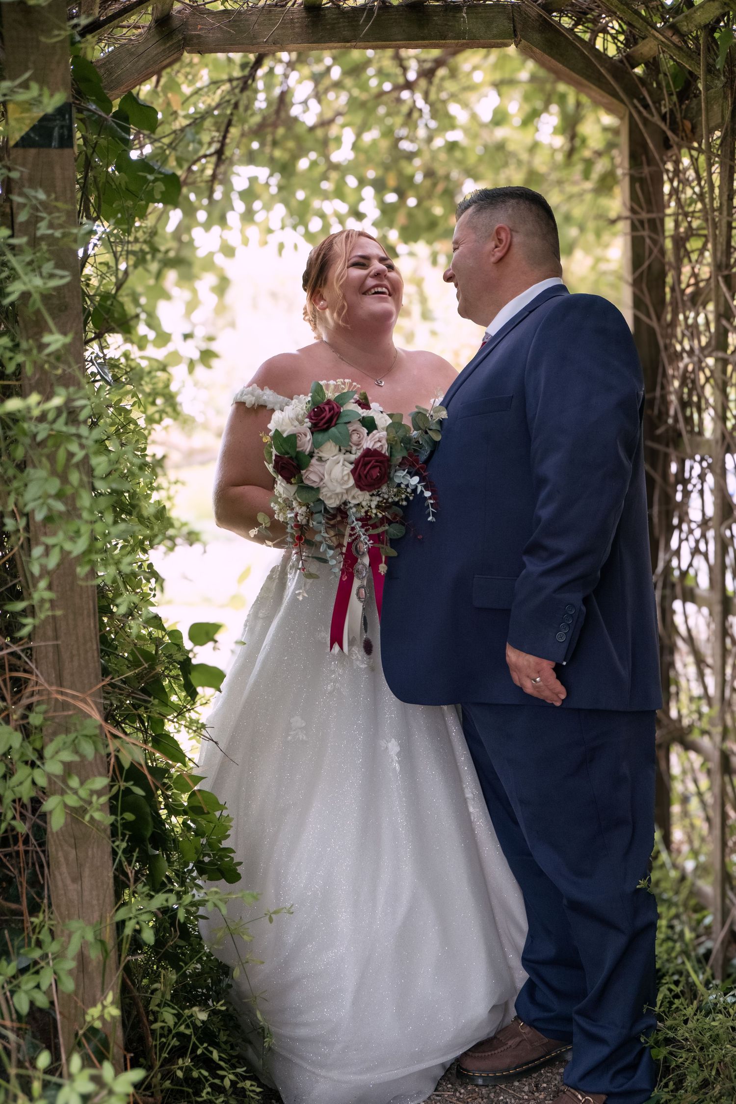 Bride and groom sharing a romantic portrait after their wedding ceremony.