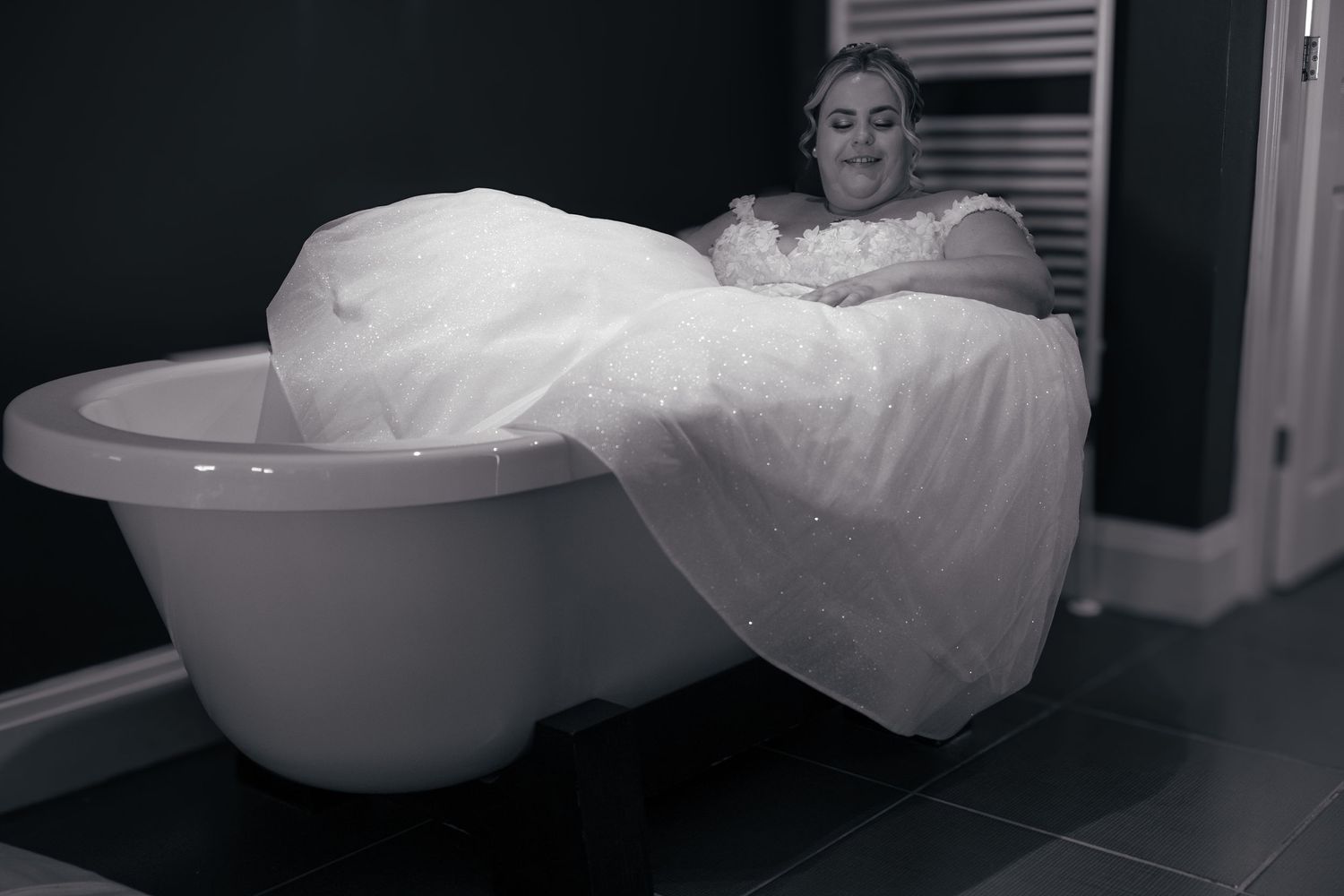 bride in the bathtub in her honeymoon suite.