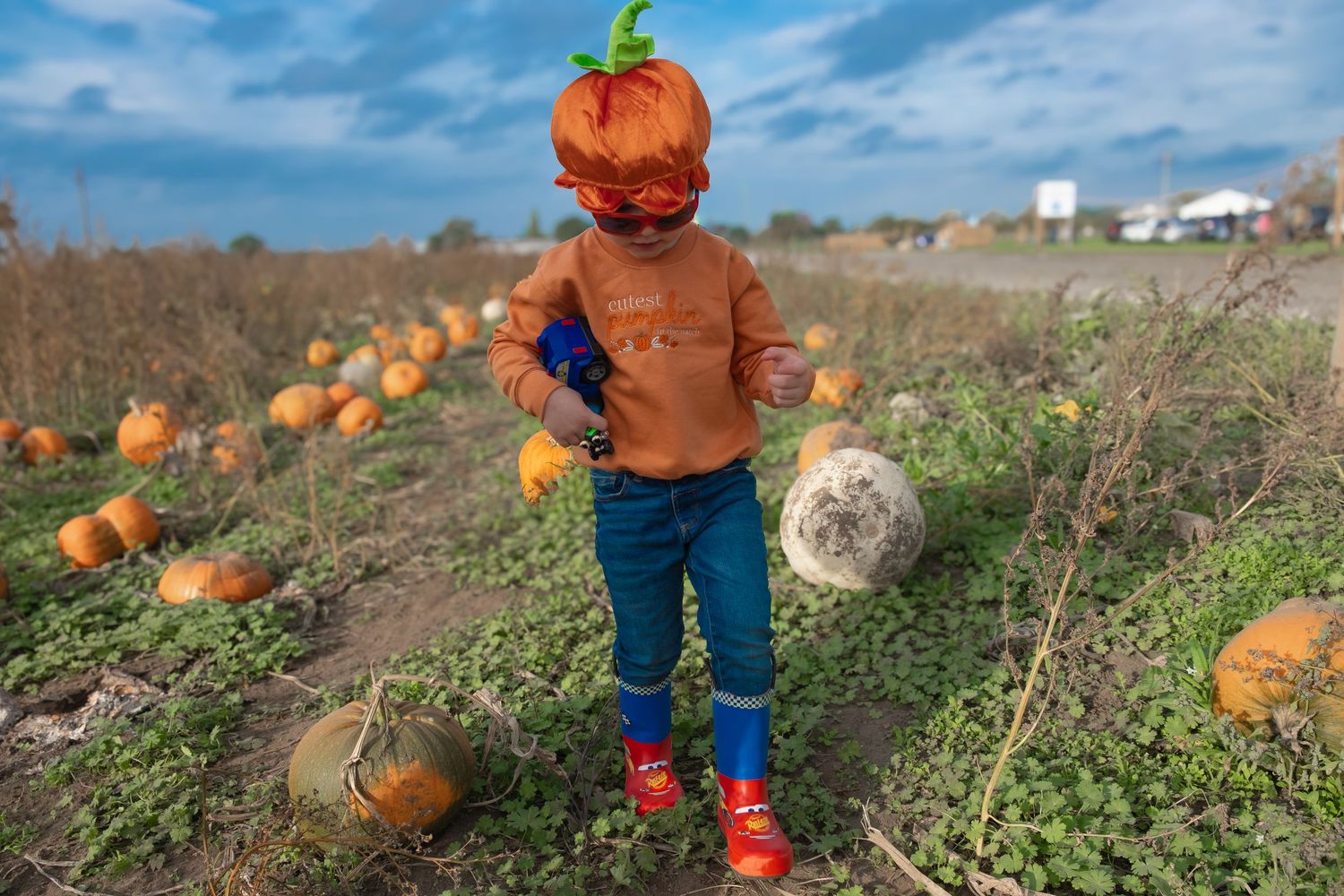 Little boy dressed for a Halloween-themed children's photoshoot.