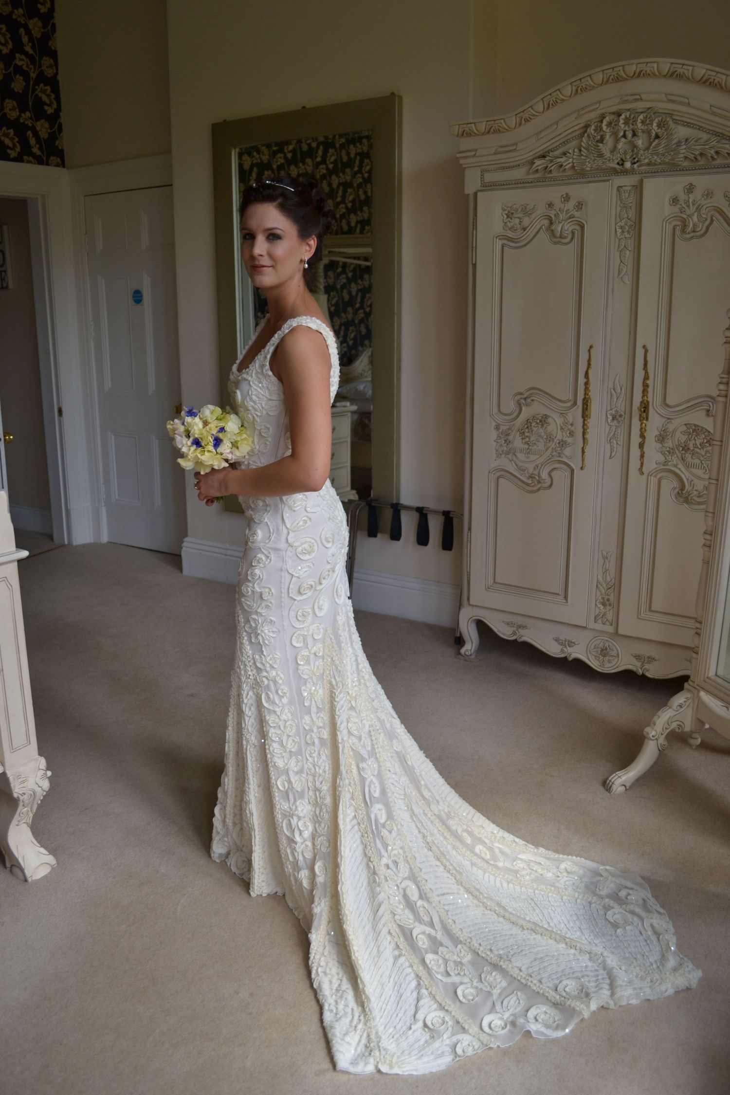 Bride ready in her wedding dress before walking down the aisle.