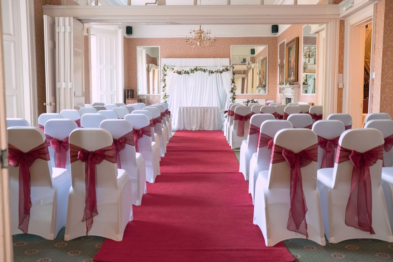 Wedding ceremony decorated ready for the groom to welcome the guests.