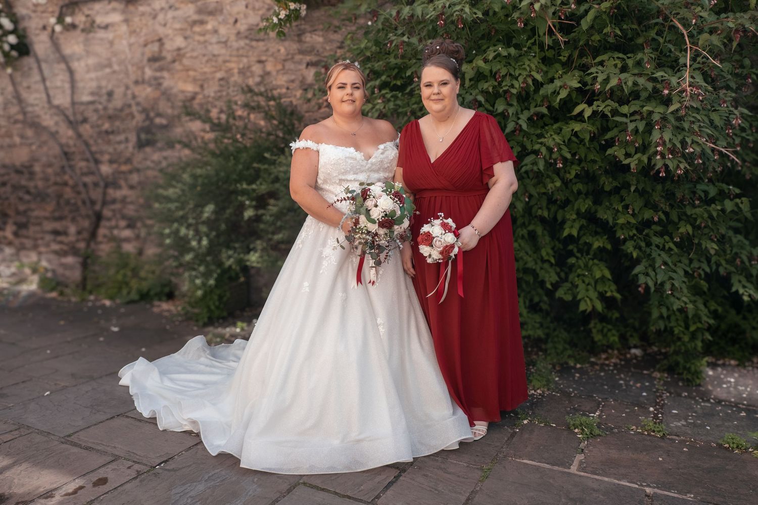 Bride with her Maid of Honour outside the wedding venue.