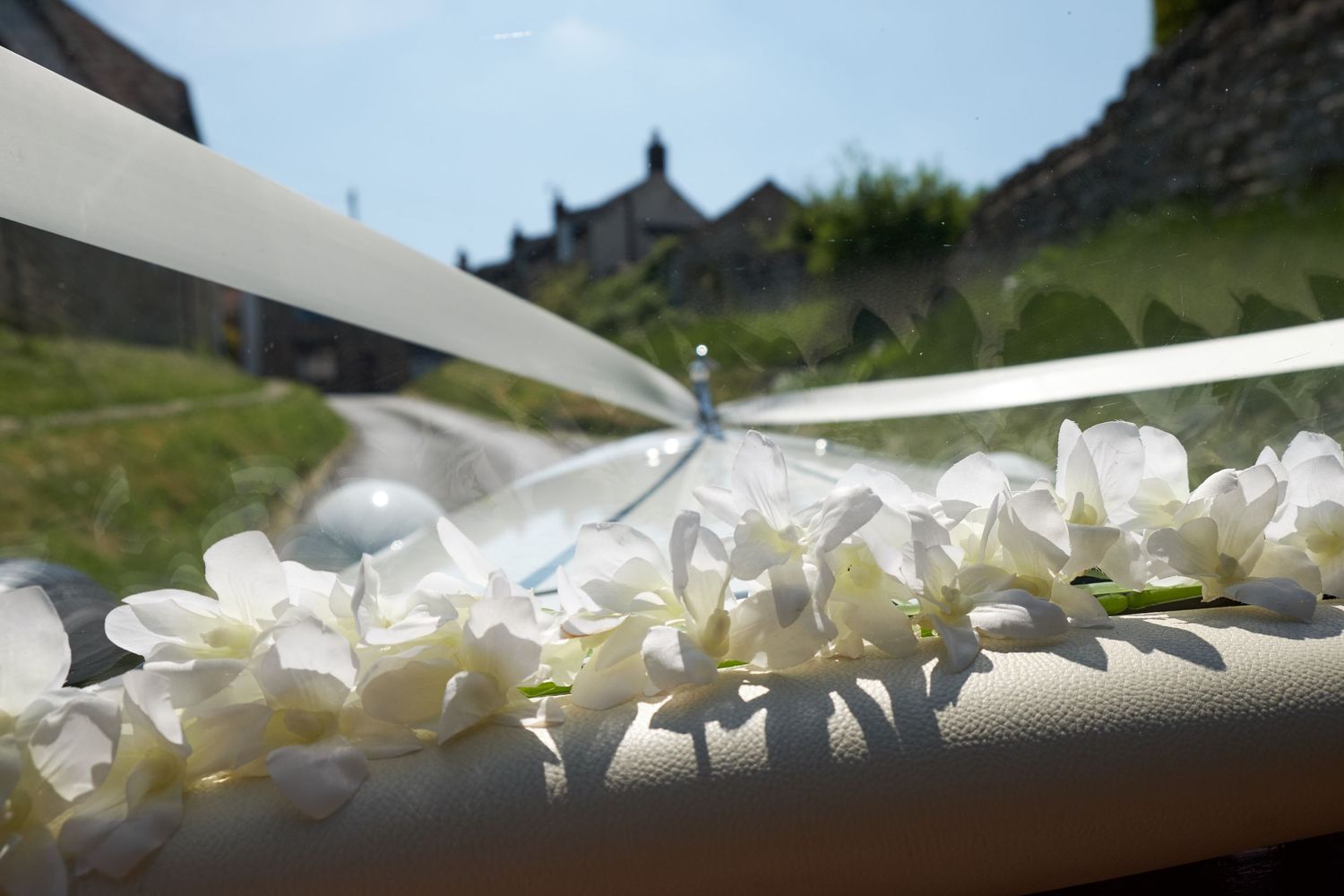 Artistic photo of the front of the wedding car.