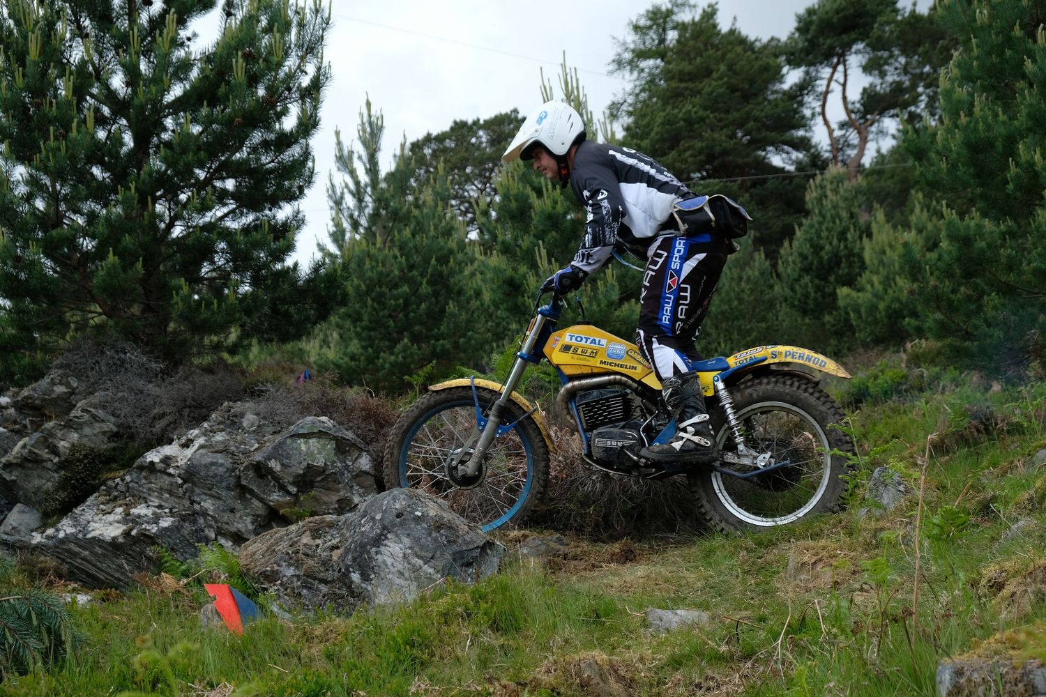 Man on a SWM trials motorbike at Aviemore in Scotland.