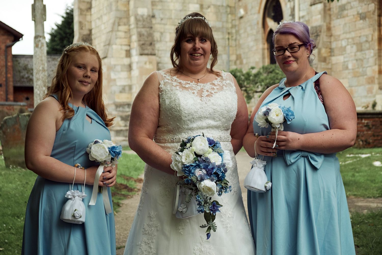 Bride with her bridesmaids outside the church.