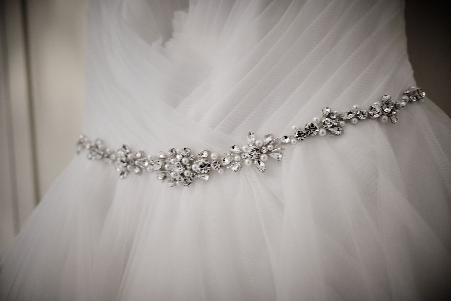 Brides wedding dress in detail.