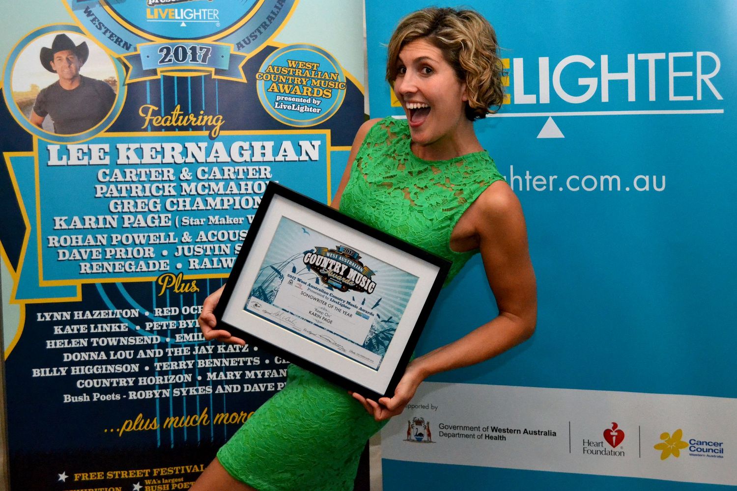 Karin Page holding her award from the Boyup Brook Country Music Festival in Western Australia.