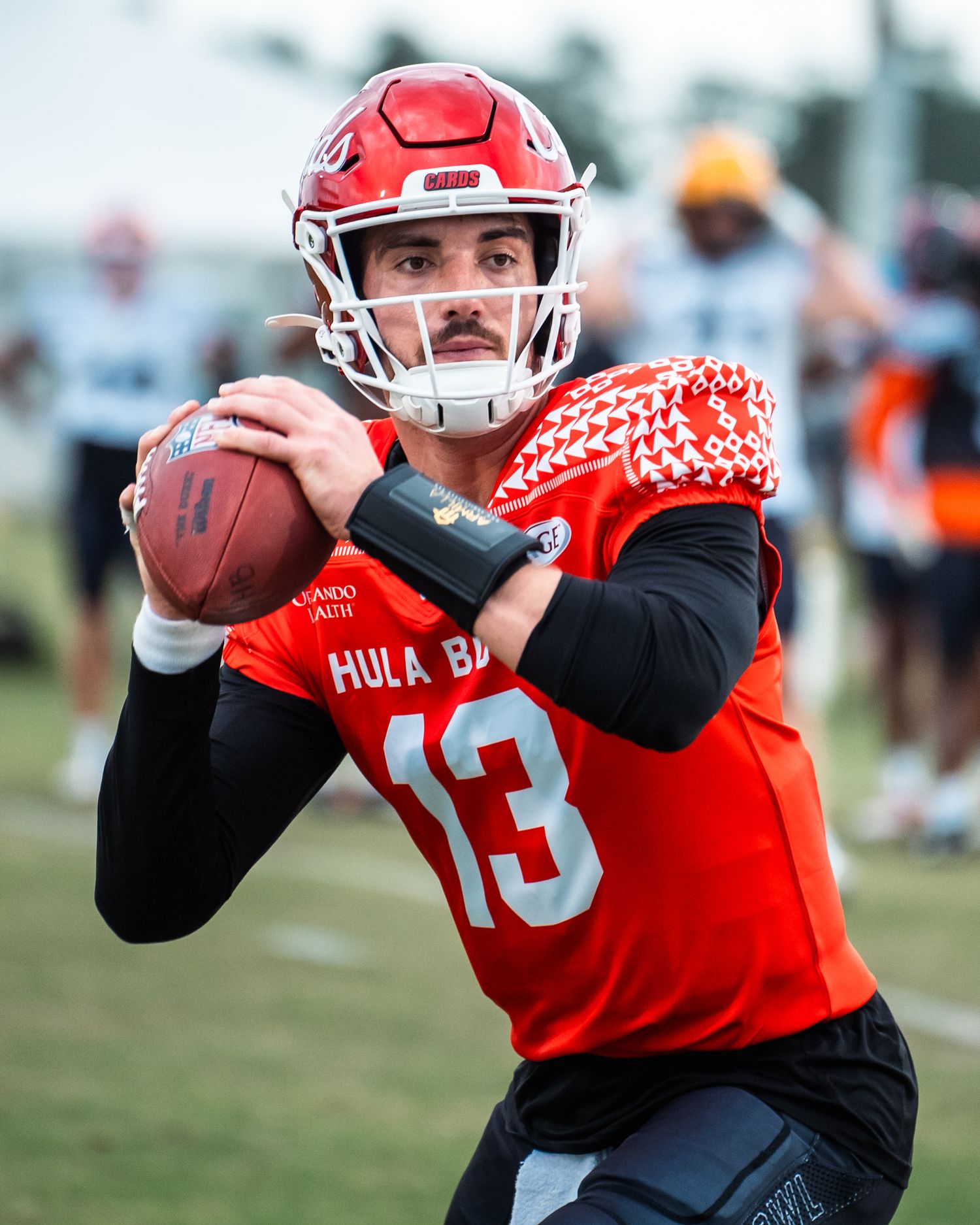 Orlando sports action photographer K-Mo Snaps capturing a quarterback for the Hula Bowl