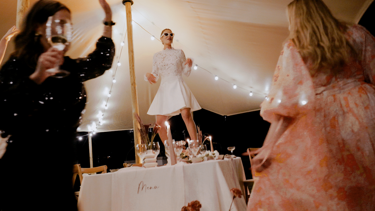Bride dancing on table for his wedding party