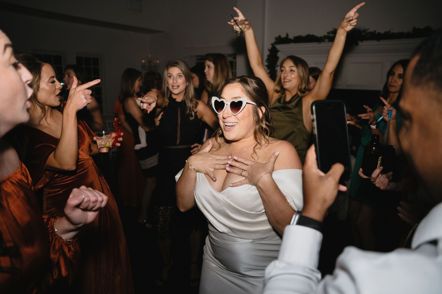 A candid image of a bride on the dance floor on her wedding day.