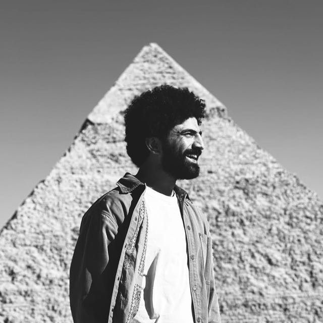 Black and white photo sequence showing a figure turning to face the Great Pyramid of Giza in Egypt.