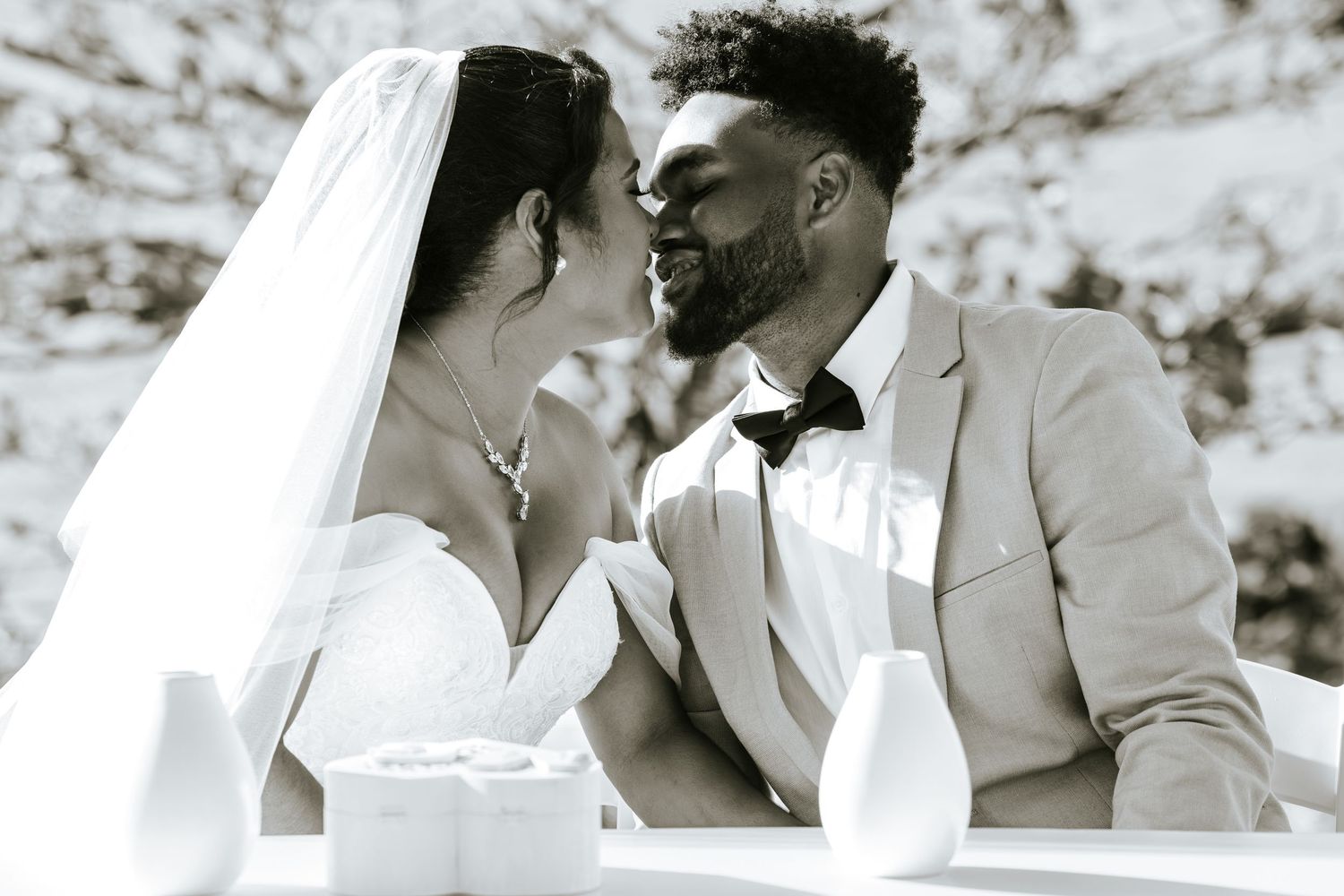 A romantic sepia-toned wedding photo collage showing intimate moments between newlyweds.