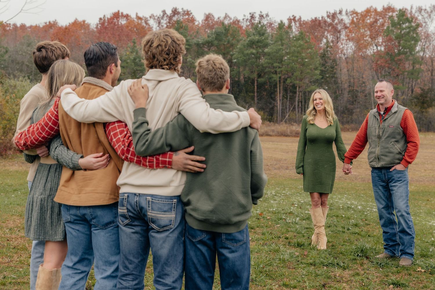 Family portrait session in Fenton, MI featuring parents and adult children, photographed by Brena B Imagery. Parents smiling at kids.