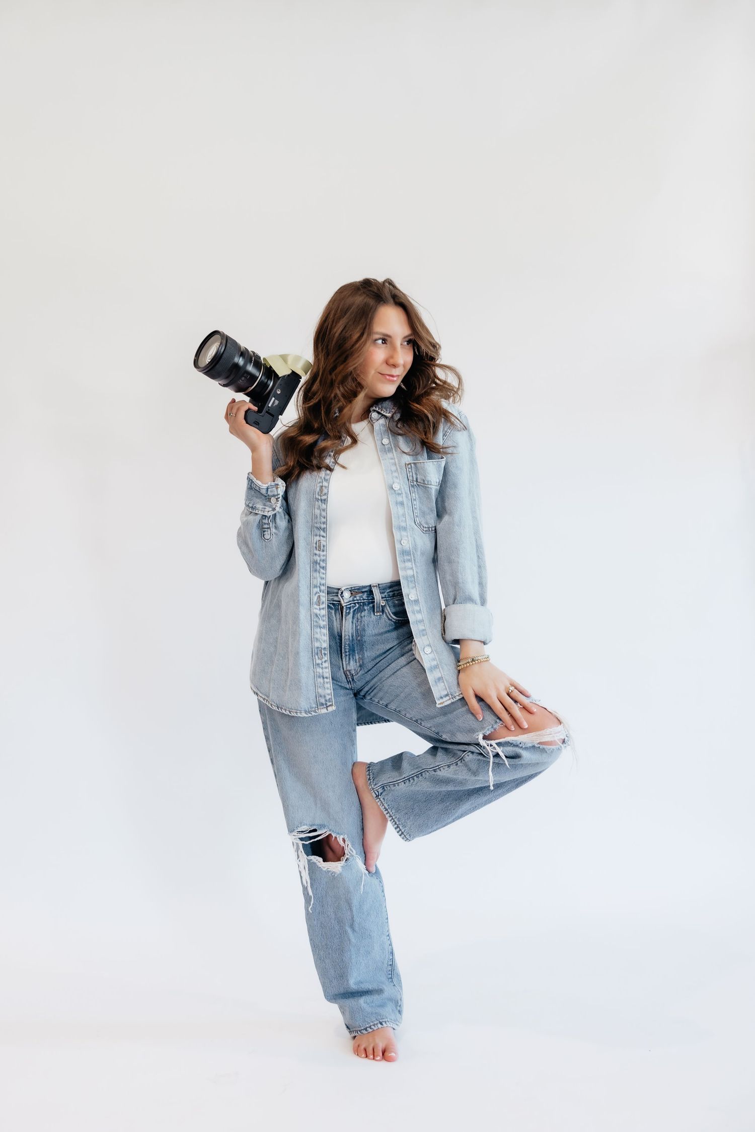 Brena B Imagery Howell, Michigan senior and wedding photographer wearing denim in photography branding session posing.
