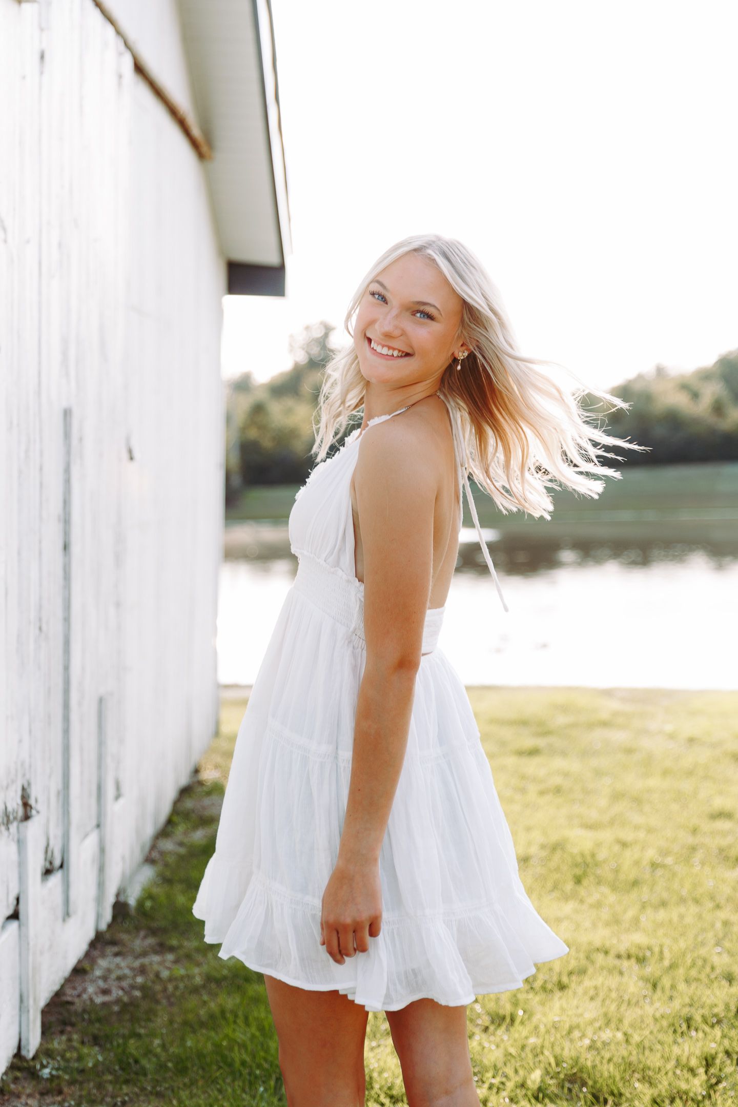 Dreamy golden hour senior session by Howell, Mi Senior Photographer Brena B Imagery. Country White Barn, golden hour.