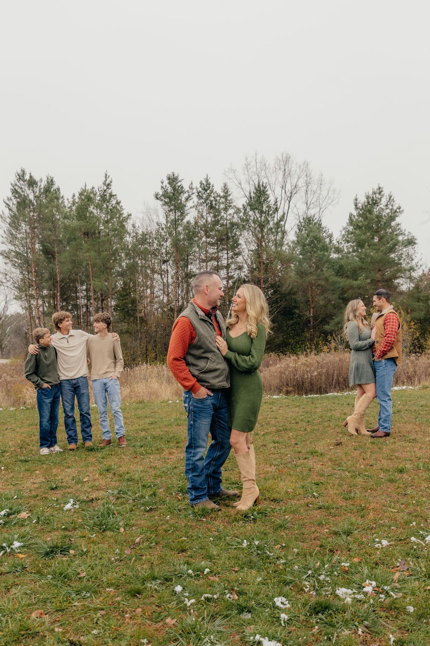 Family portrait session in Fenton, MI featuring parents and adult children, photographed by Brena B Imagery. Grouped up.