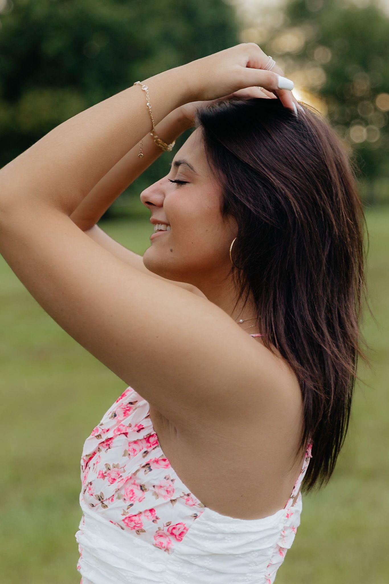 Dreamy golden hour senior session by Howell, Mi Senior Photographer Brena B Imagery. Senior Inspo girl playing with hair