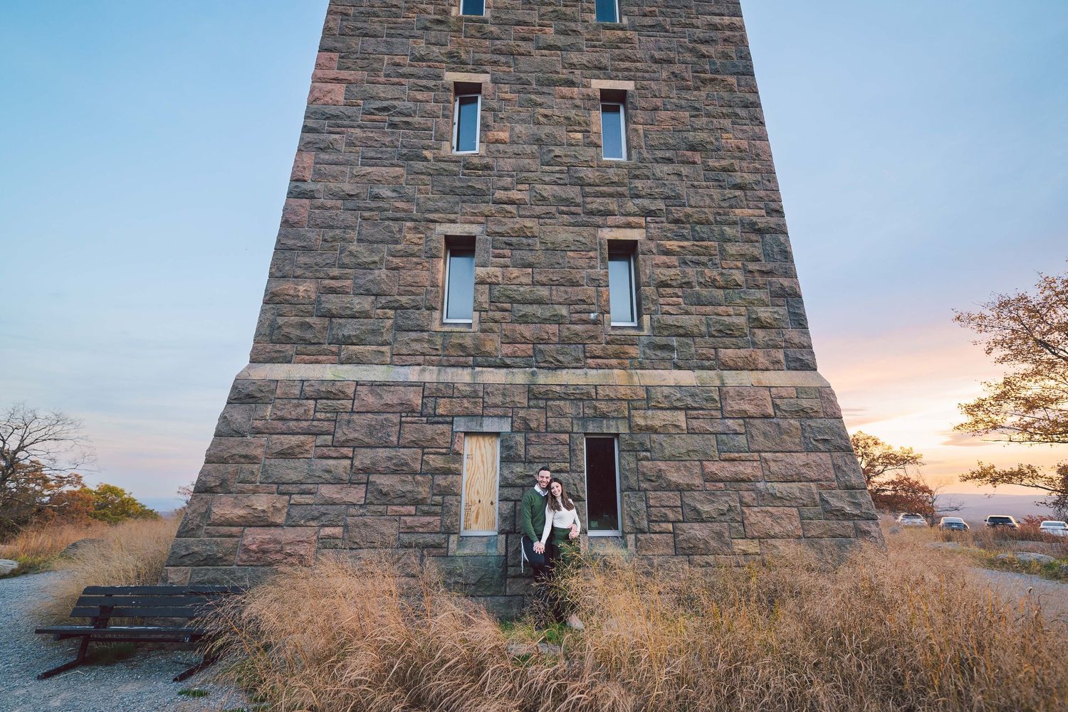 Stone tower stands against colorful sunset sky at Ensign Peak in Salt Lake City, Utah.