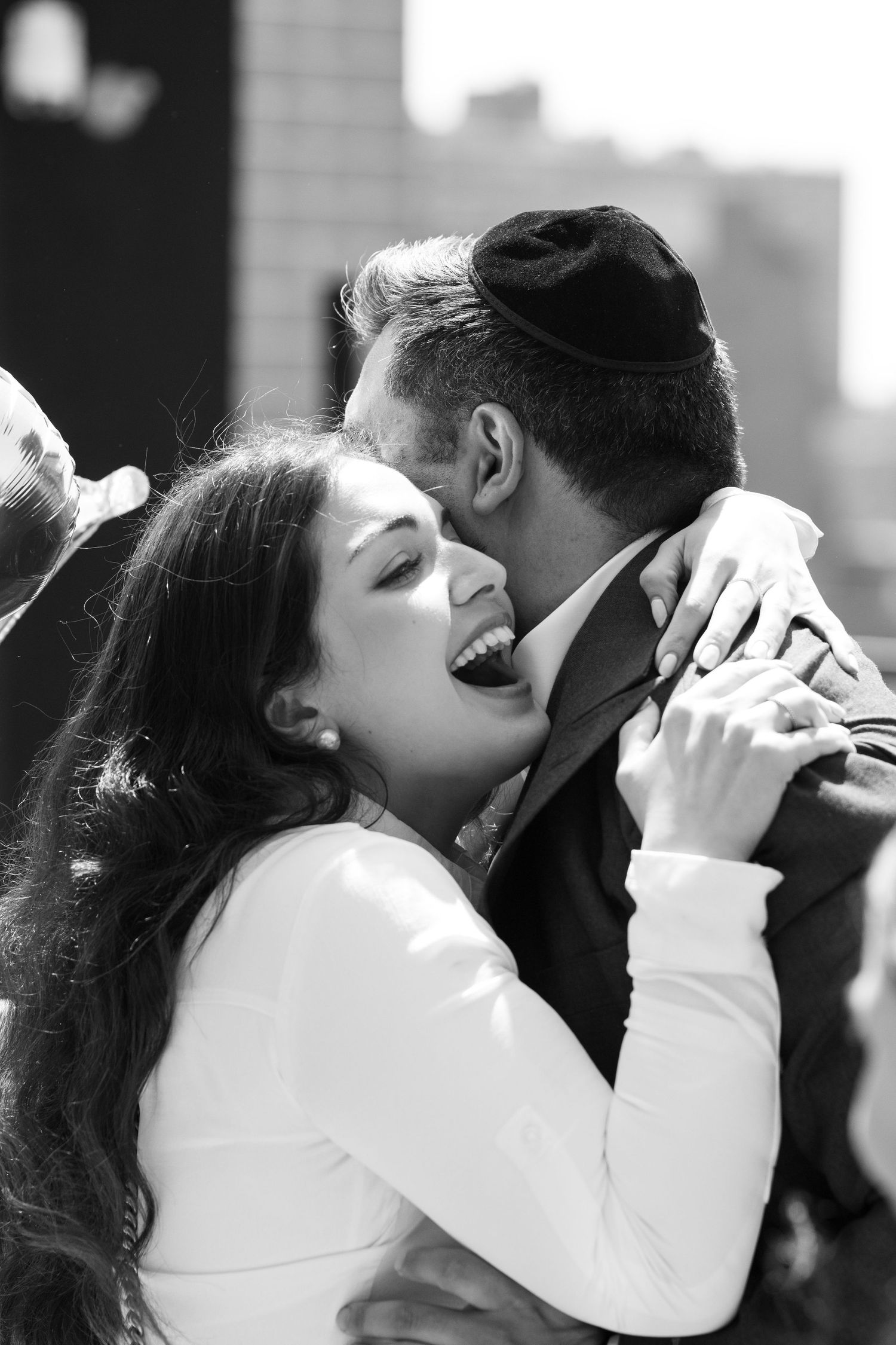 Romantic black and white portrait of a couple sharing an intimate moment.