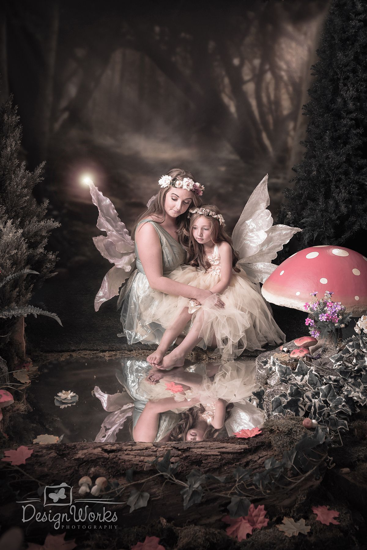 Whimsical fairy-themed portrait with toadstool props and magical forest backdrop.