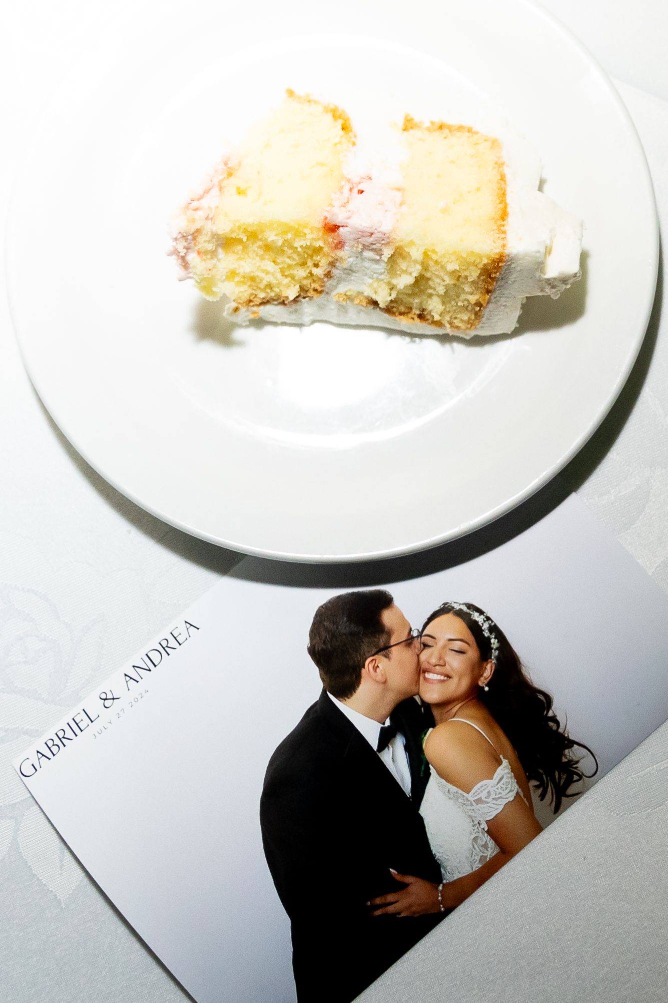 A romantic black and white wedding photo series showing a couple kissing in four sequential shots.
