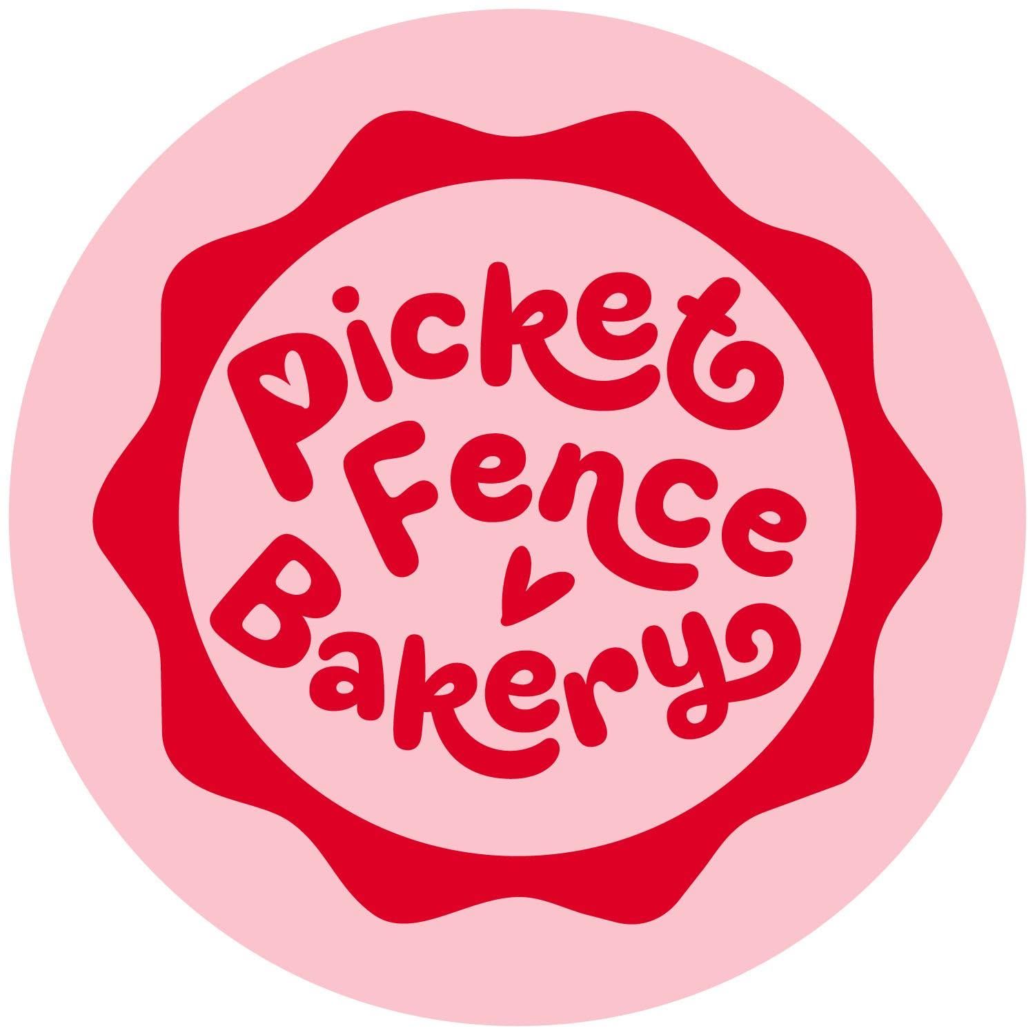 Picket Fence Bakery logo with red text on a pink circular badge with a wavy red border.