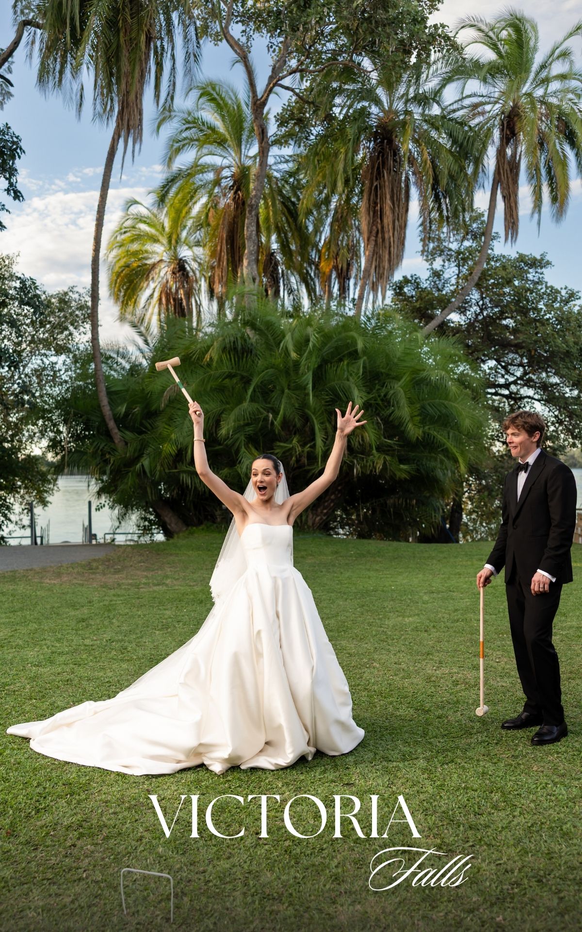 Joyful wedding photo at Victoria Falls with palm trees and a flowing white gown. - JCclick Wedding photo & Film - Best Cape Town Photographe