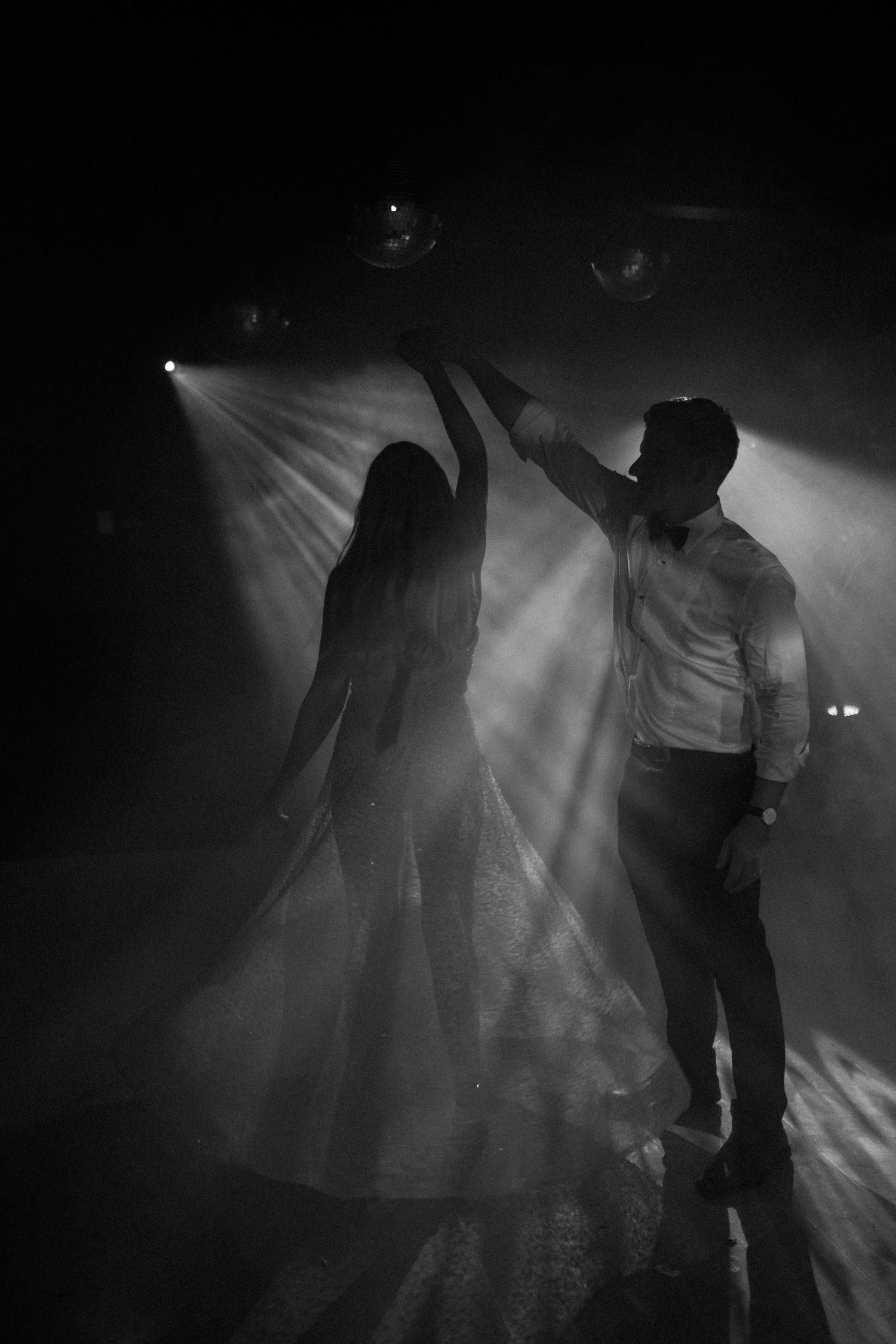 Silhouettes dancing in atmospheric fog and stage lighting. - JCclick Wedding photo & Film - Best Cape Town Photographer.