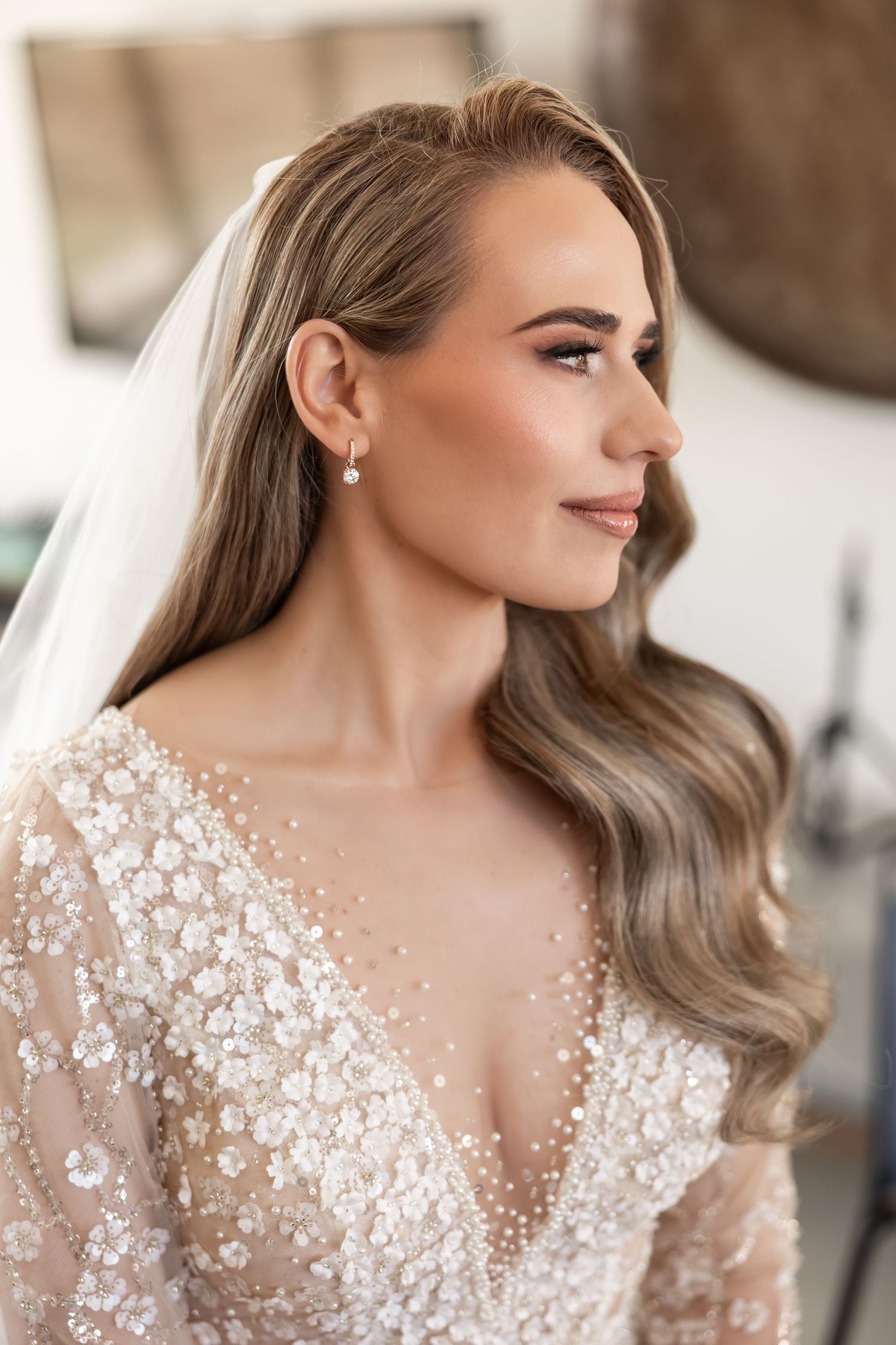 Close-up detail of delicate white floral lace on a wedding dress.  JCclick Wedding photo & Film - Best Cape Town Photographer.