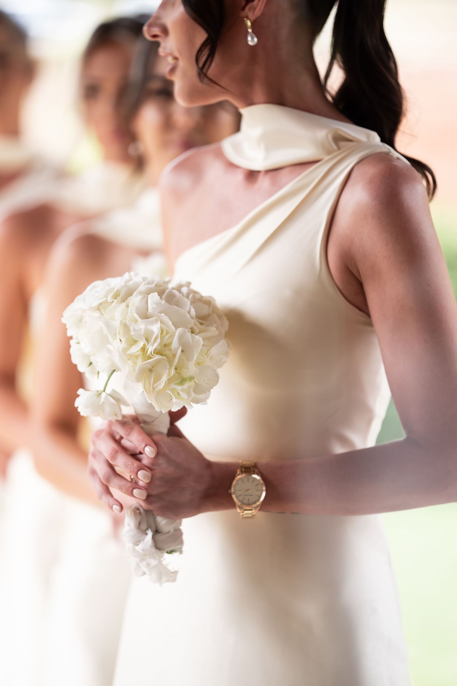Elegant bridesmaid in cream dress holding white hydrangea bouquet.  JCclick Wedding photo & Film - Best Cape Town Photographer.