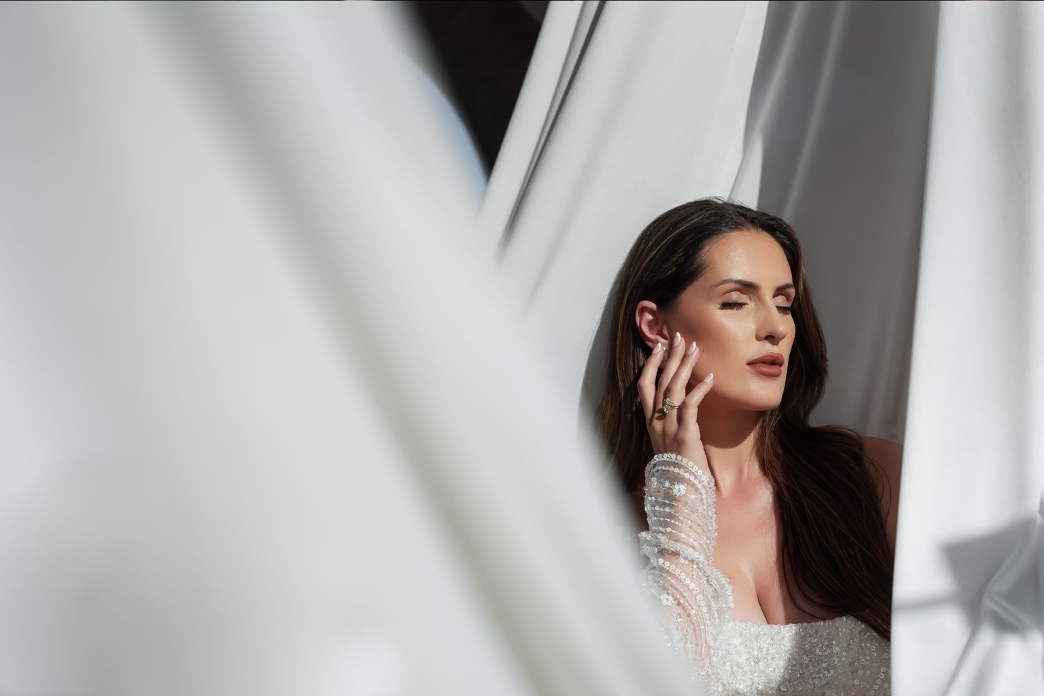 Artistic bridal portrait with dramatic shadows and white fabric in minimalist setting. - JCclick Wedding photo & Film - Best Cape Town Photo