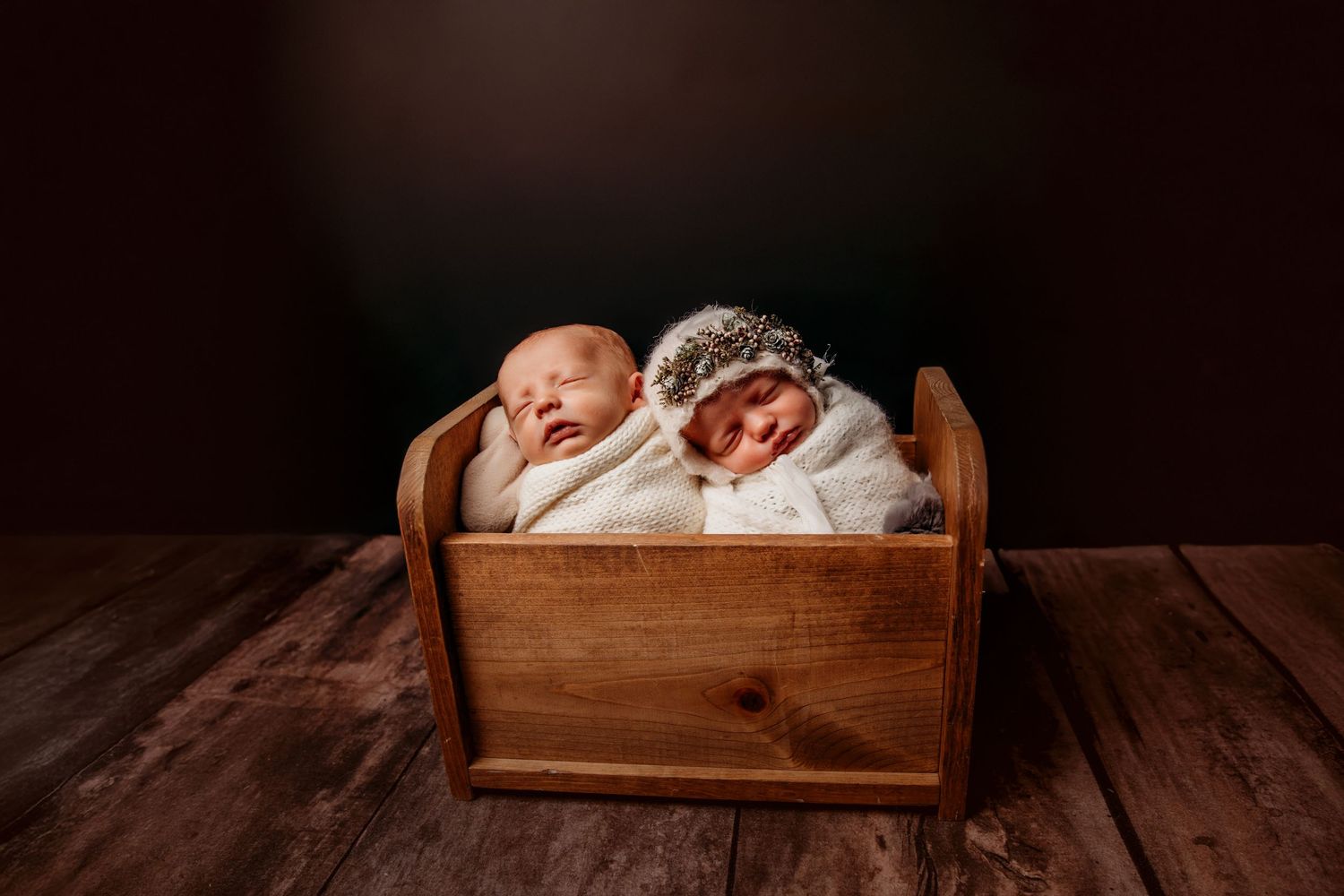 Rustic wooden crates arranged in a dark moody setting.