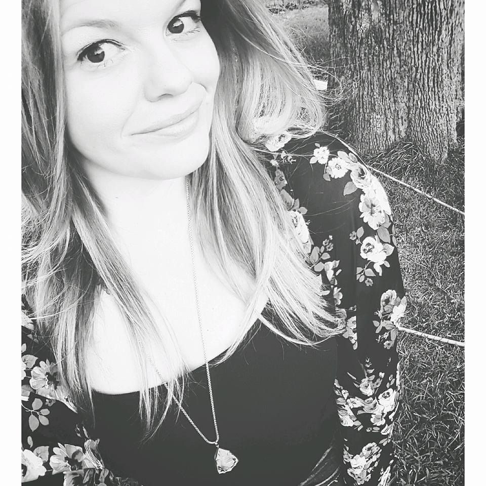 Black and white portrait series showing a person with long hair in different poses against dark backgrounds.