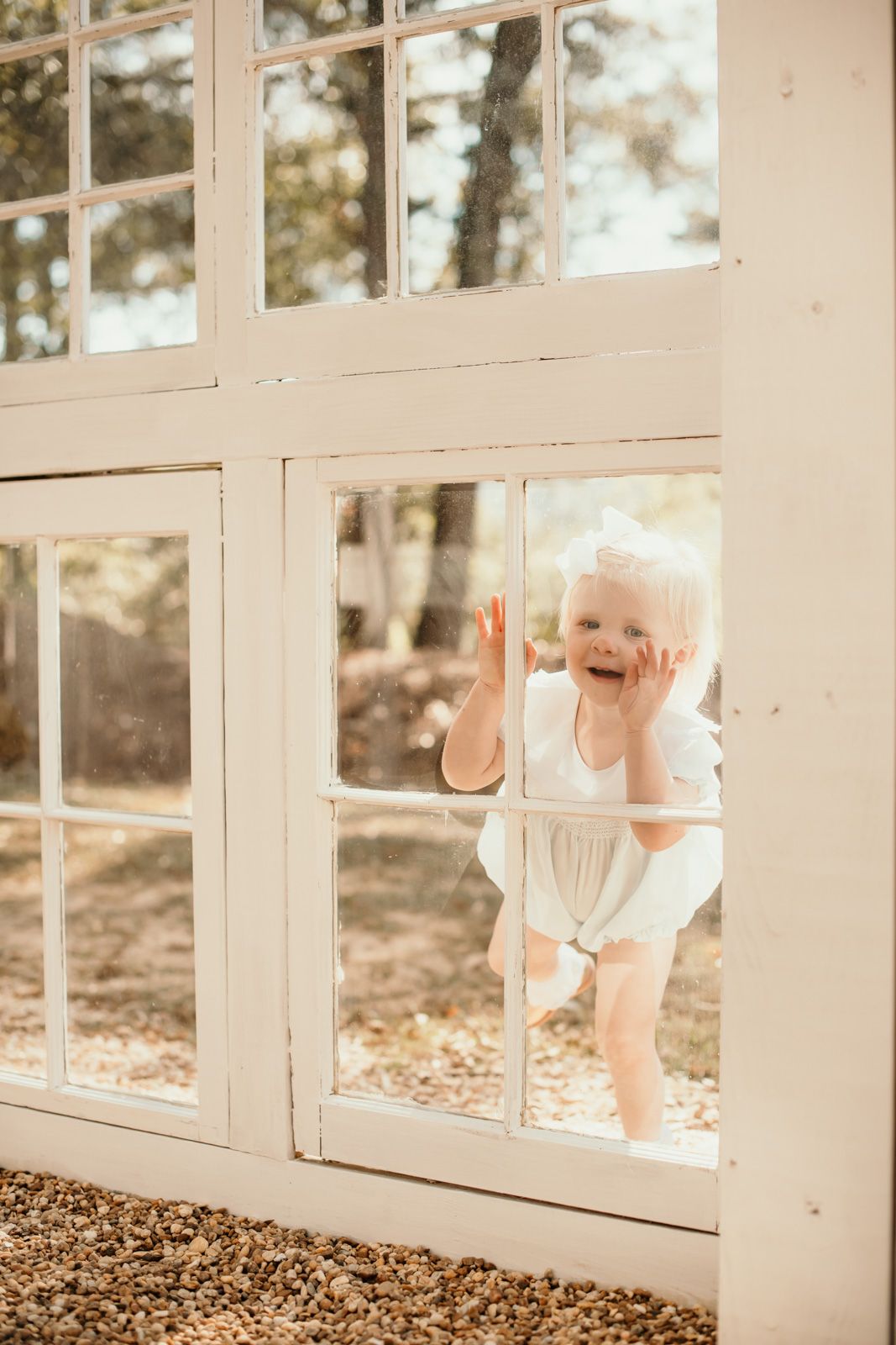 White French doors frame a cozy indoor setting with scattered autumn decorations.