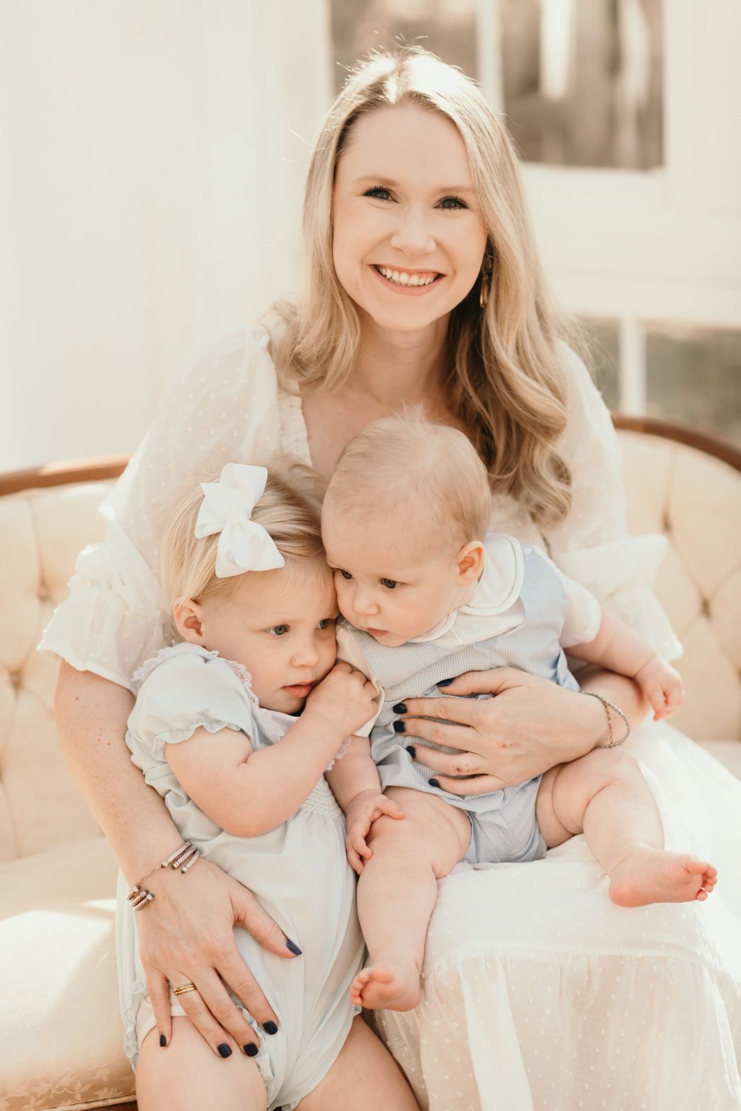 Tender family moment captured in soft lighting on vintage furniture.