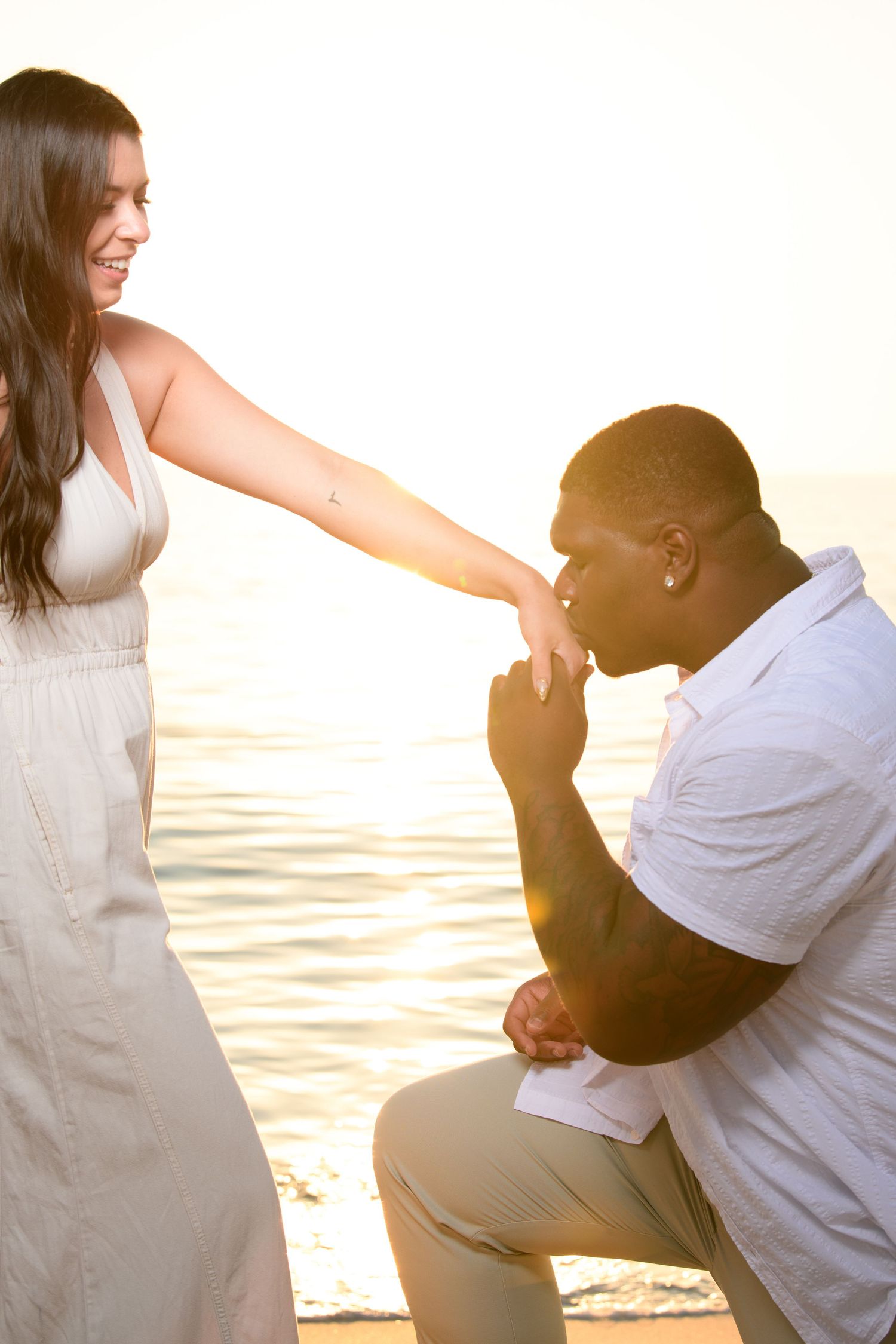 Sunset beach proposal sequence showing a couple's special moment. Engagement photoshoot. Couples photos.