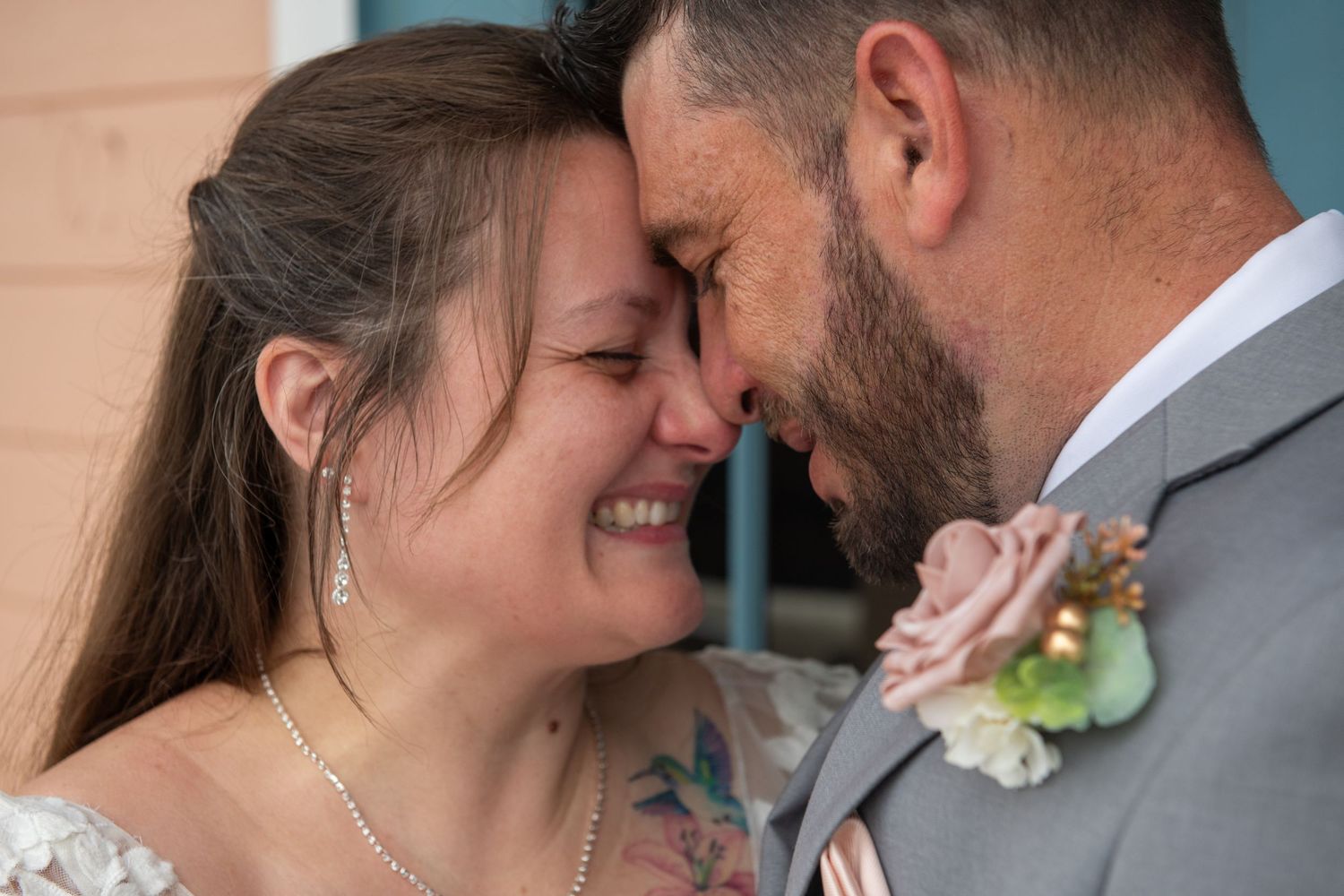 Romantic black and white portraits of newlyweds sharing tender moments.